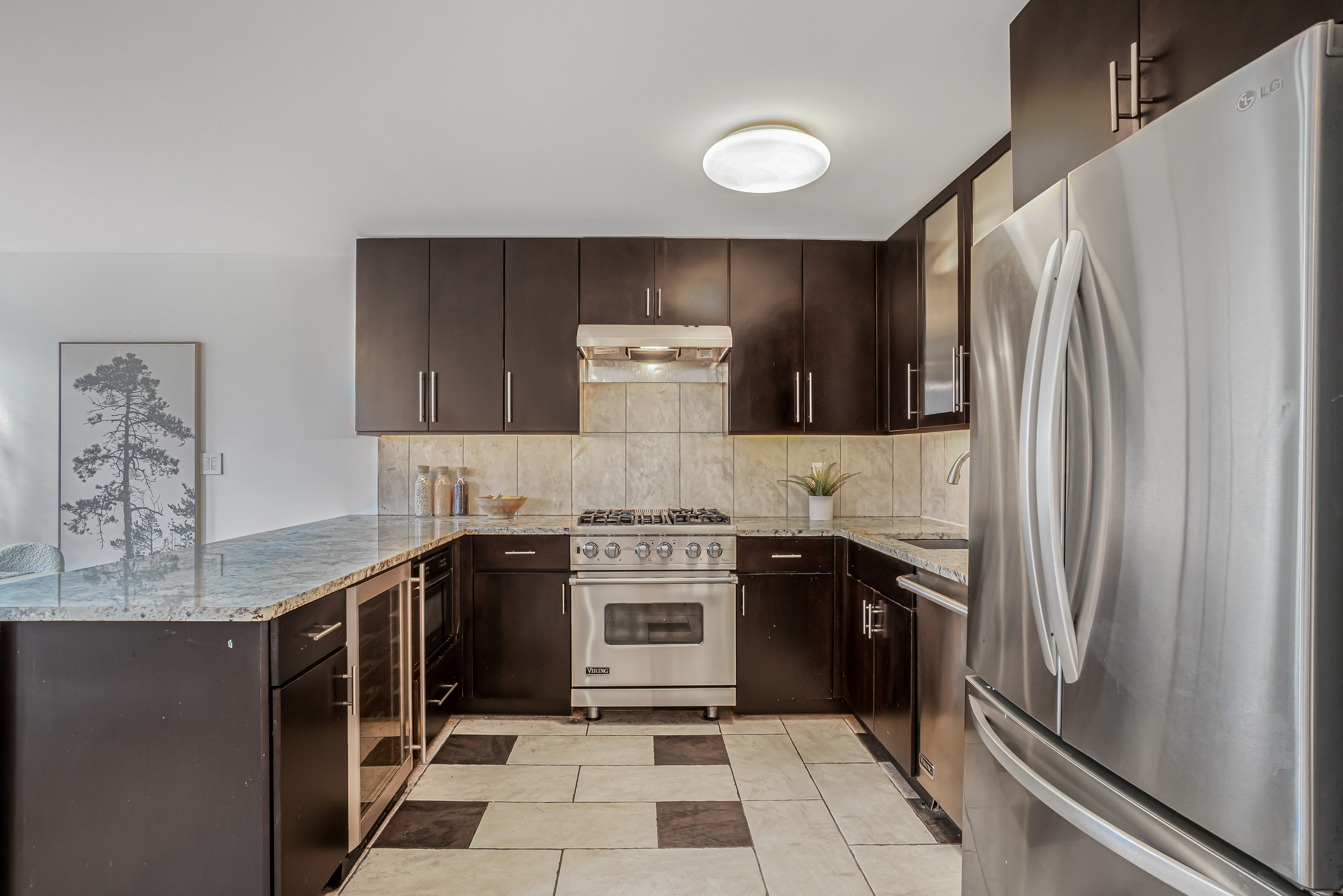 7 Gates Avenue, Unit H Brooklyn, NY 11238 - Photo 3 of 20 a kitchen with stainless steel appliances granite countertop a stove a refrigerator and a sink
