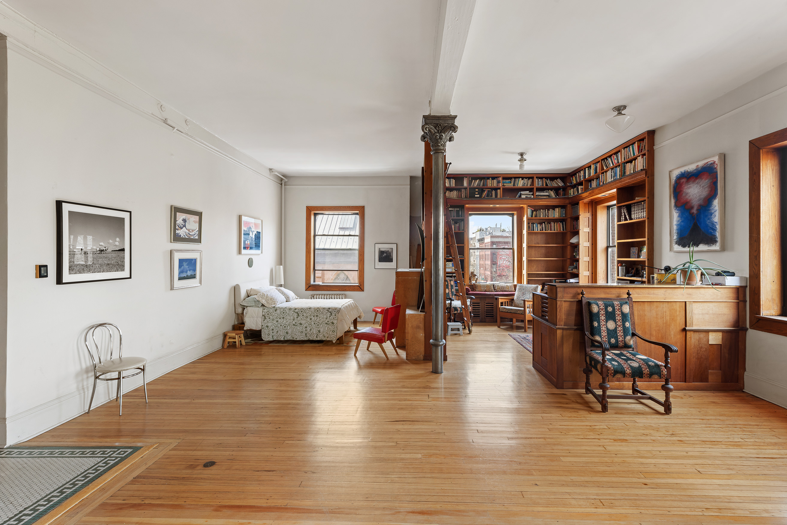 295 East 8th Street, Unit 3W Manhattan, NY 10009 - Photo 7 of 18 a living room with furniture window and wooden floor