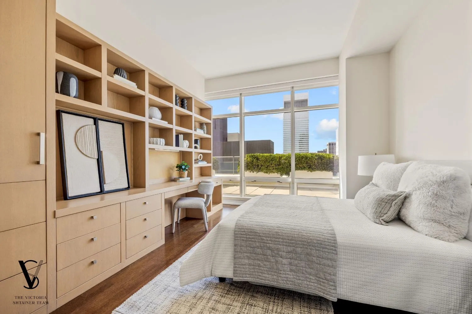 a bedroom with a large bed and a window
