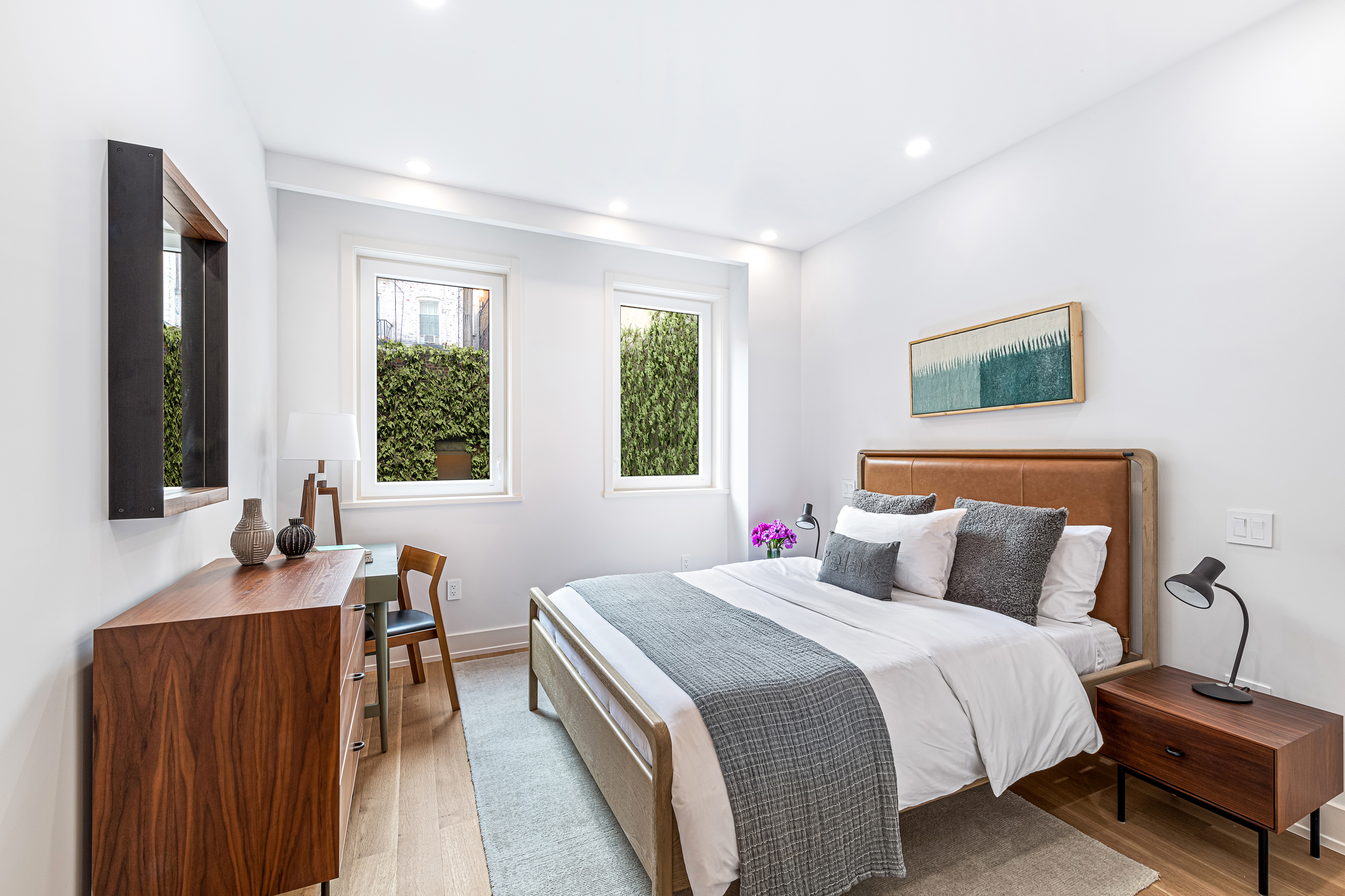 420 East 75th Street, Unit 2 Manhattan, NY 10021 - Photo 11 of 25 a bedroom with a bed and wooden floor