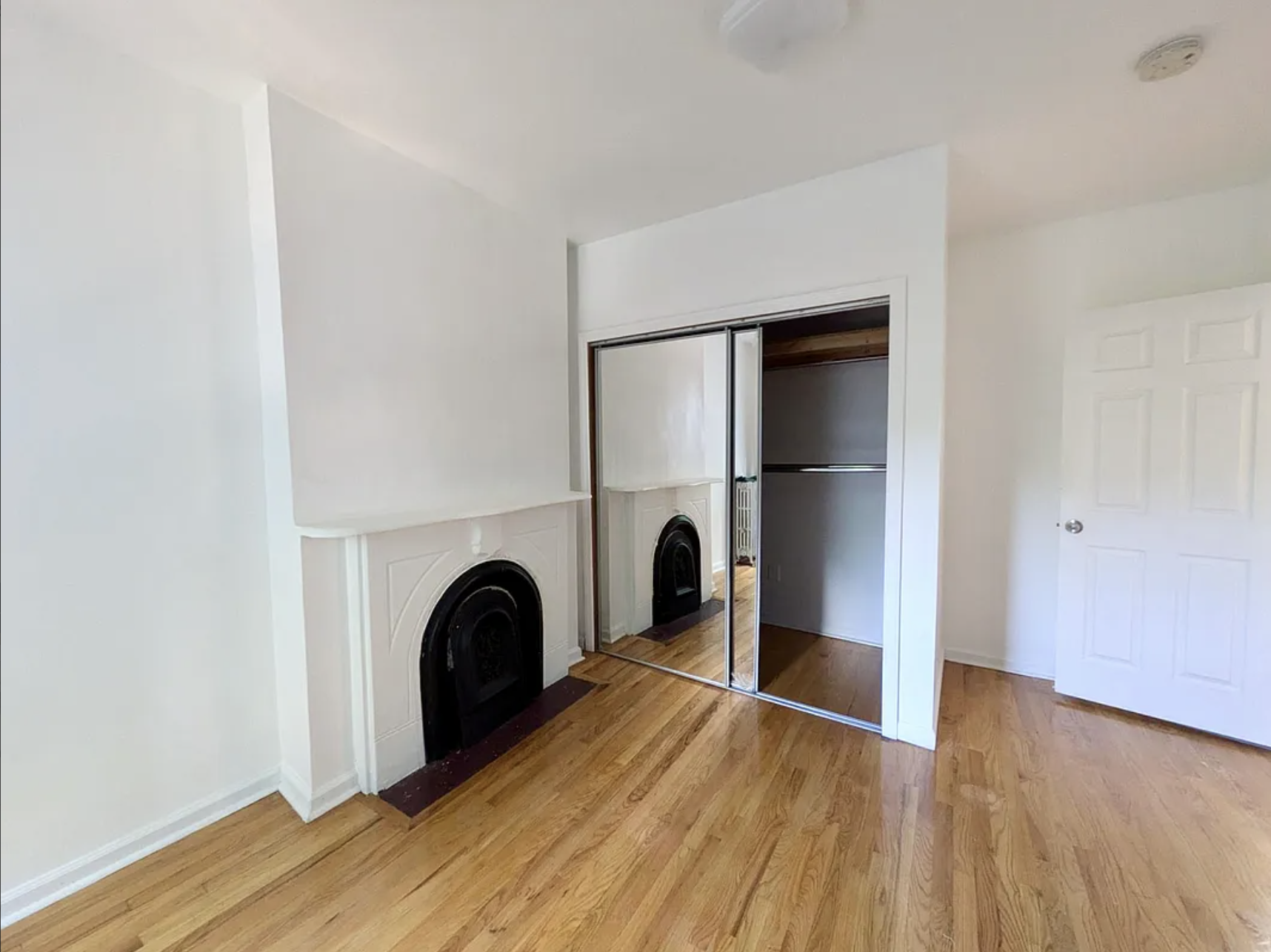 582 Monroe Street, Unit 2 Brooklyn, NY 11221 - Photo 9 of 18 a view of a livingroom with wooden floor and a ceiling fan