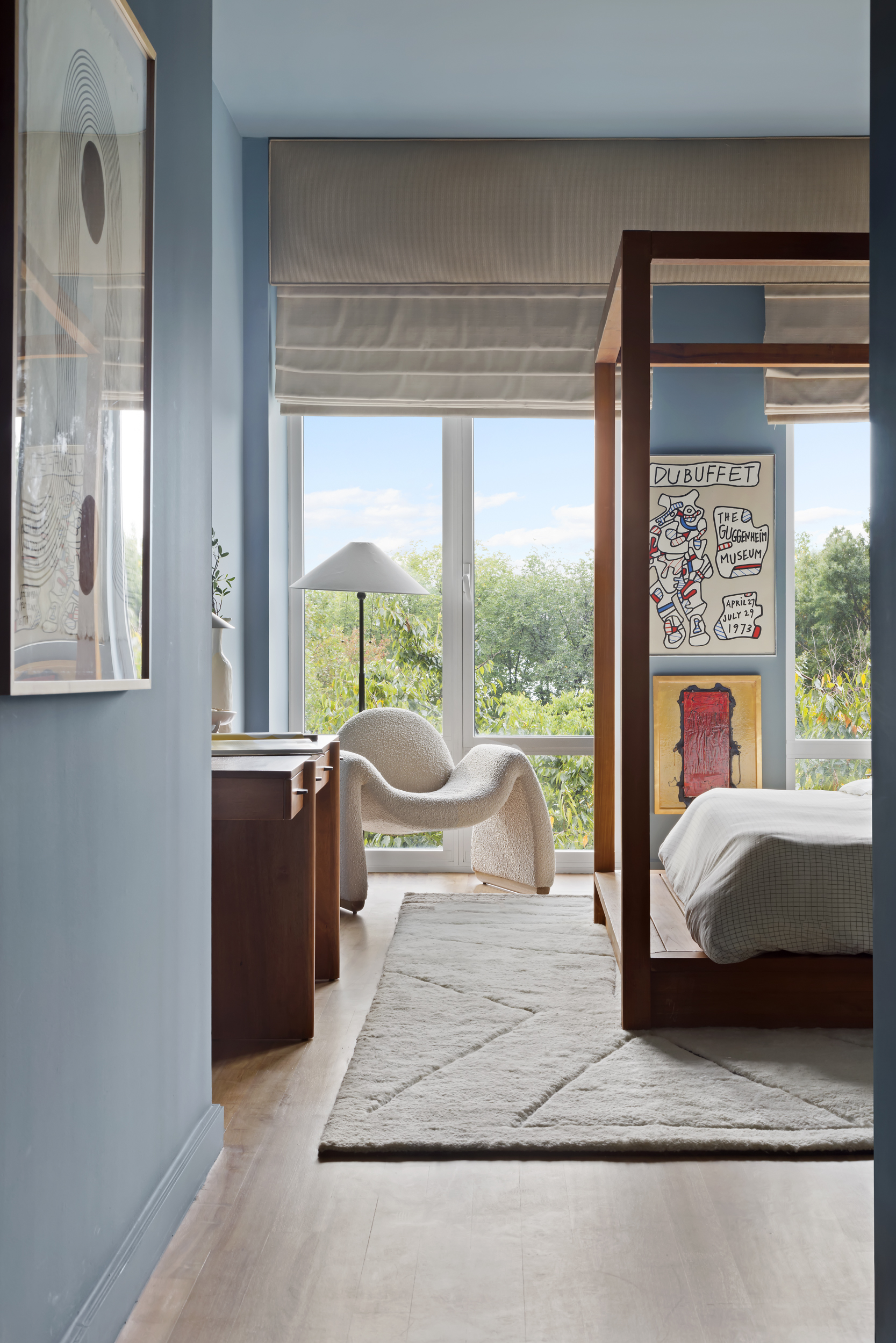 400 West 12th Street, Unit 4E Manhattan, NY 10014 - Photo 19 of 24 a bedroom with a bed and large window