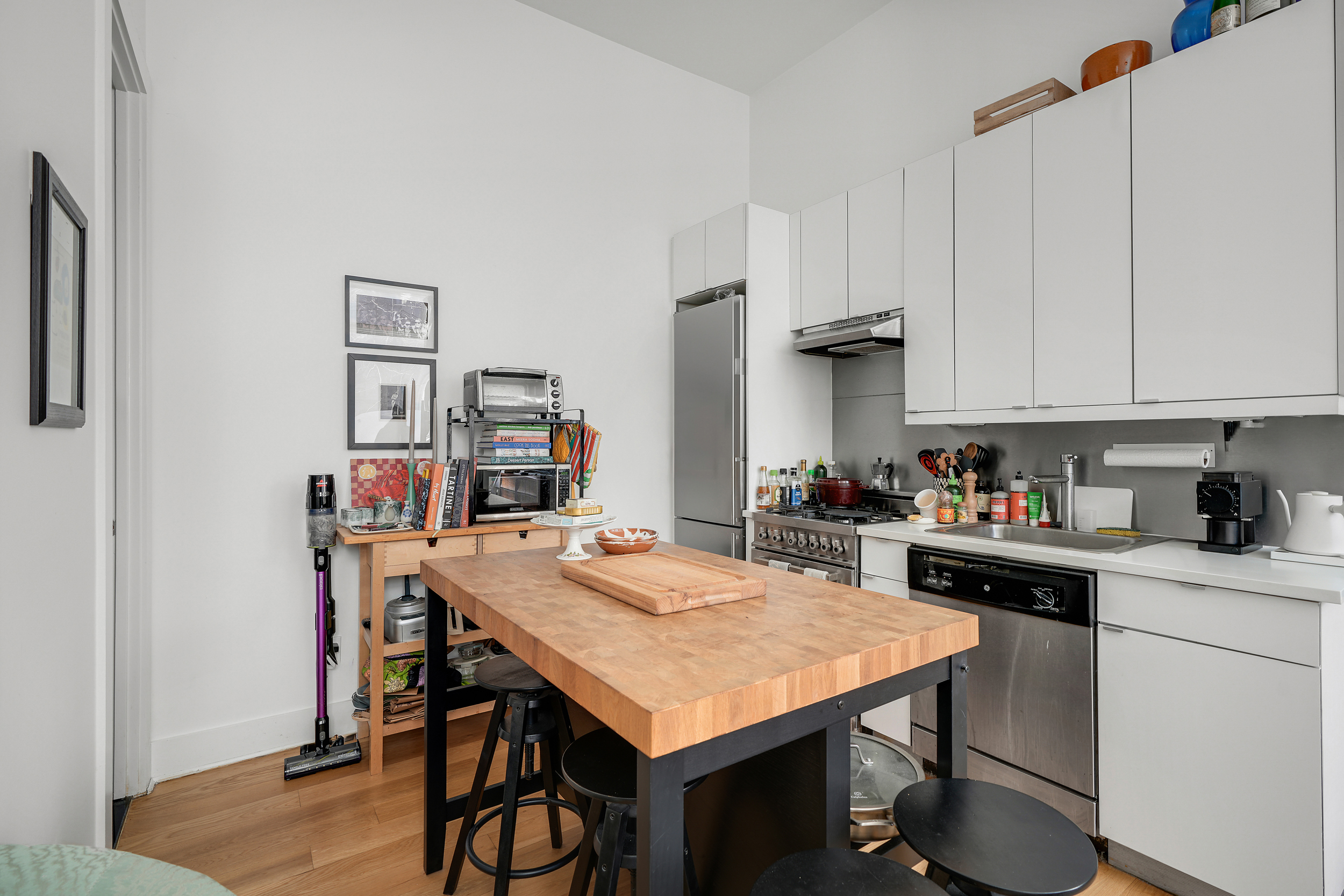 622 Grand Avenue, Unit 102 Brooklyn, NY 11238 - Photo 8 of 13 a kitchen with a table and chairs