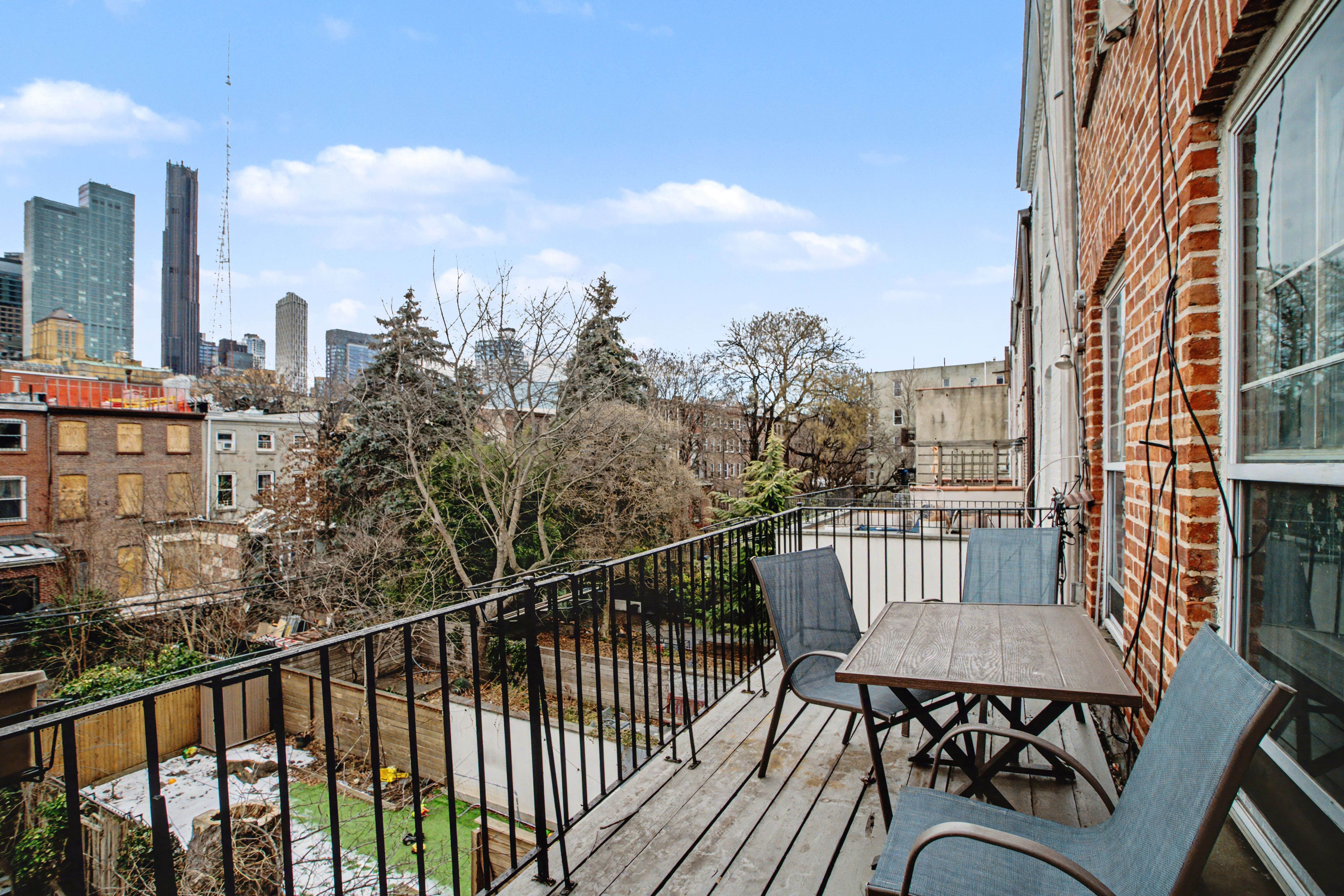 246 Cumberland Street, Unit 2 Brooklyn, NY 11205 - Photo 6 of 15 a view of a balcony with mountain view and wooden floor