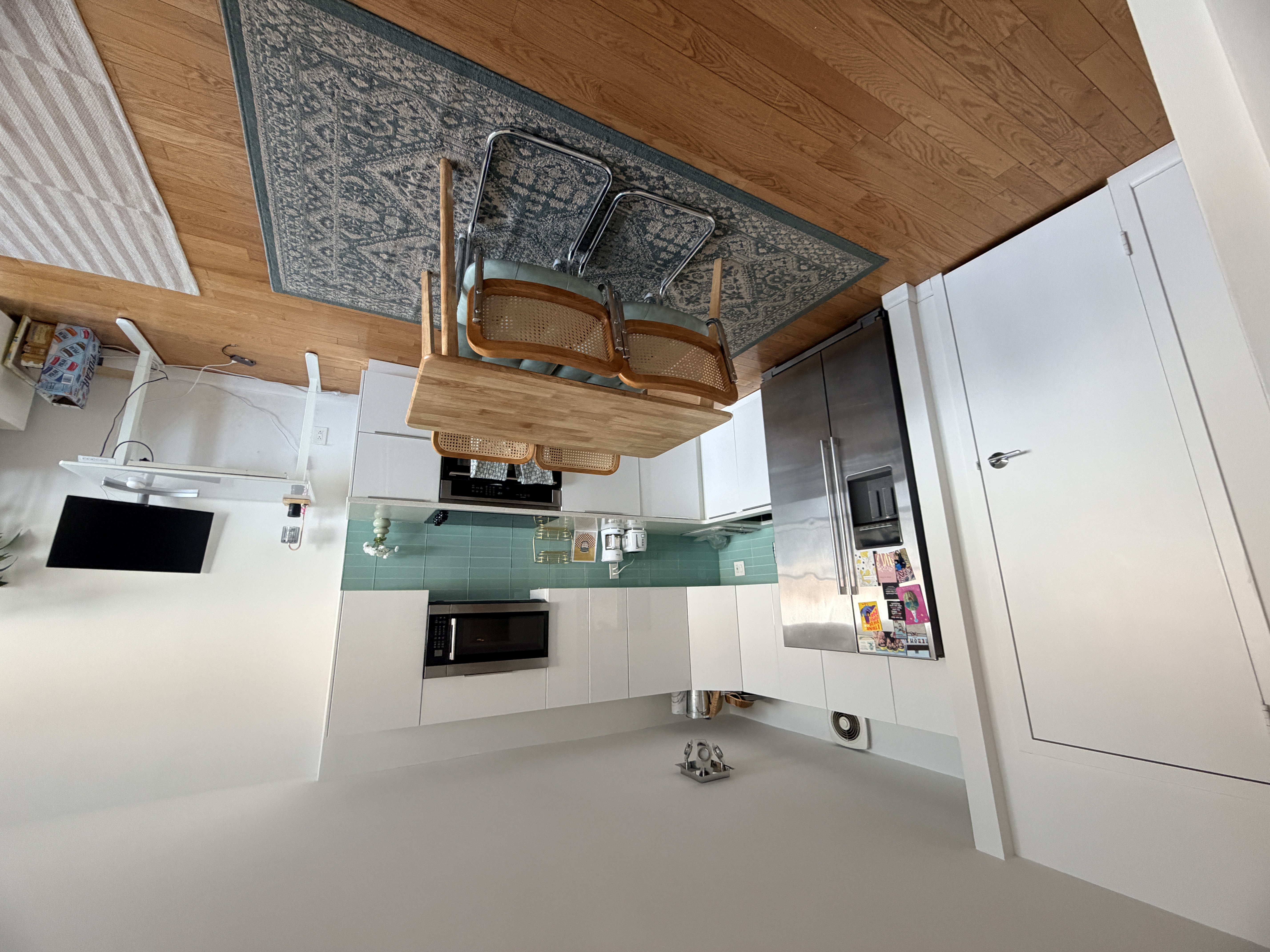 25-40 Shore Boulevard, Unit 15T Queens, NY 11102 - Photo 5 of 24 a living room with furniture and a flat screen tv