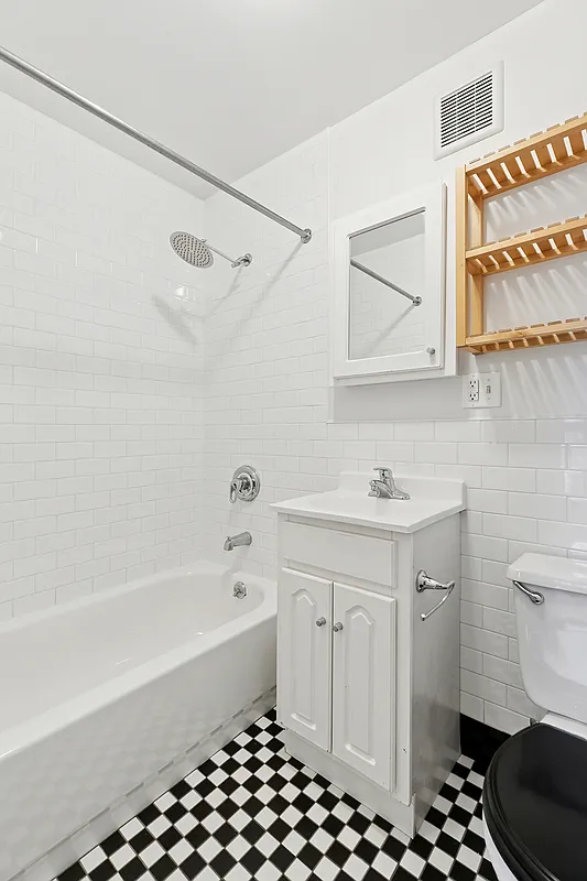 1100 Dean Street, Unit 4 Brooklyn, NY 11216 - Photo 12 of 13 a bathroom with a sink a toilet and a bathtub