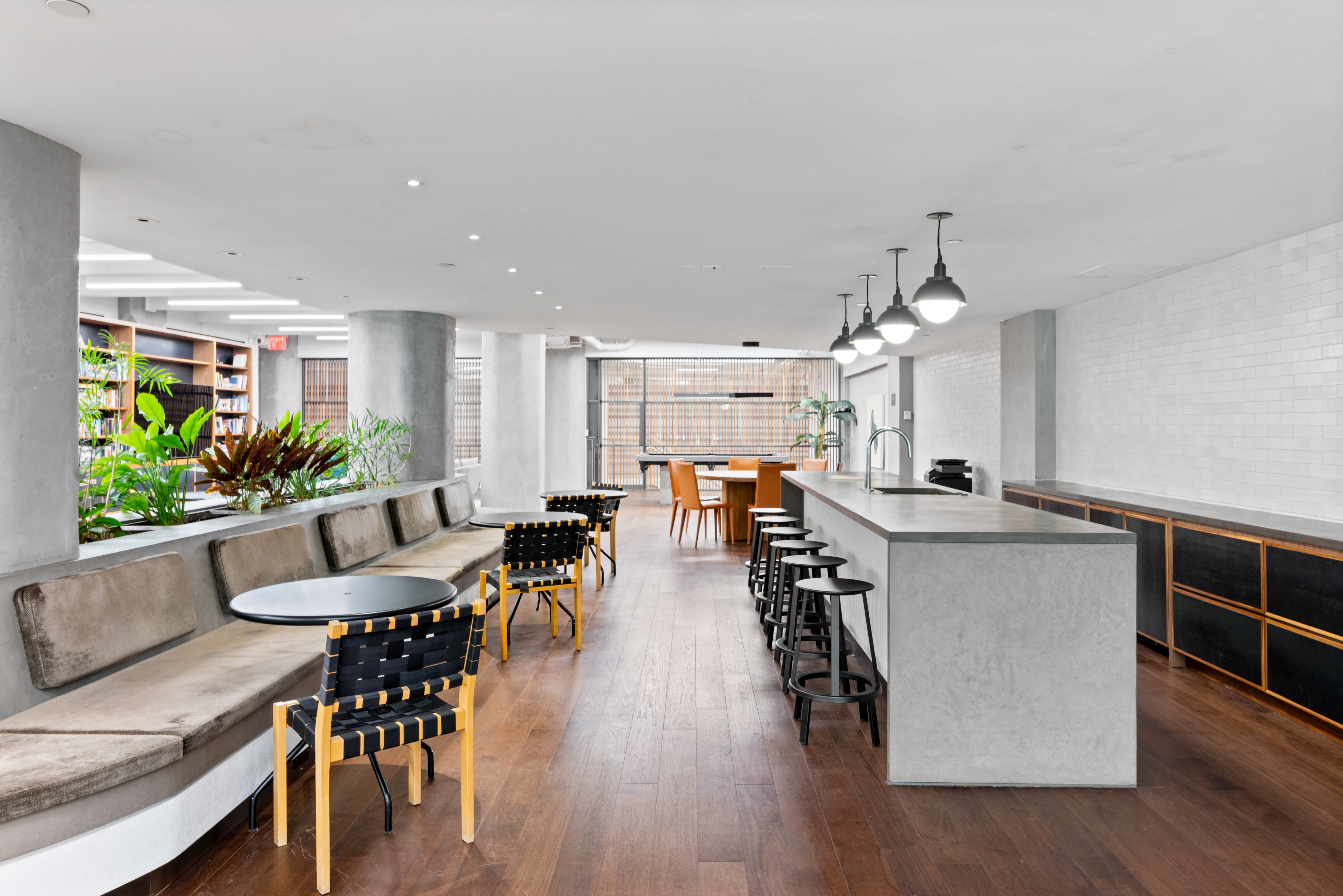 184 Kent Avenue, Unit C107 Brooklyn, NY 11249 - Photo 7 of 18 a view of a dining room with furniture and wooden floor