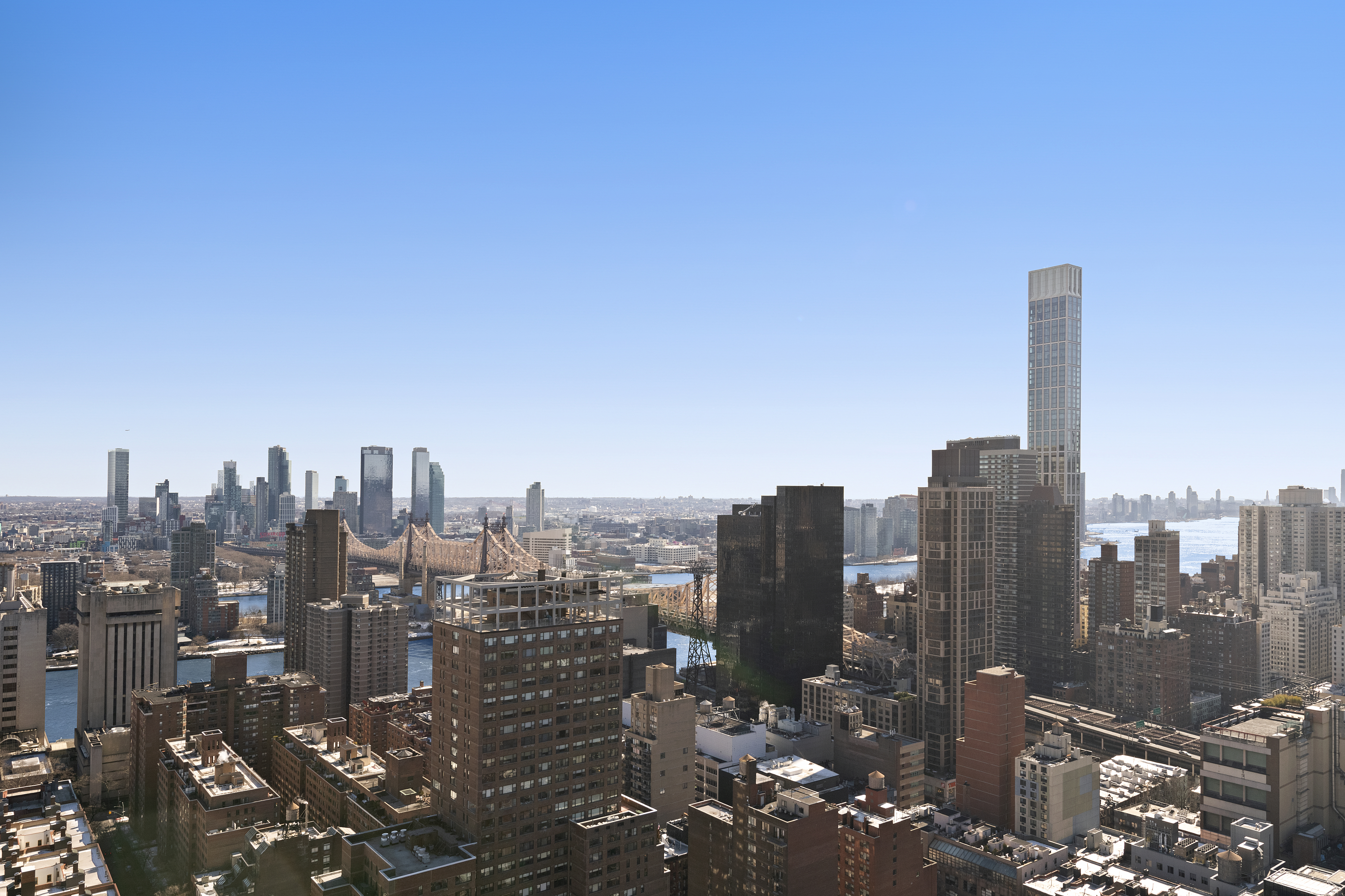 304 East 65th Street, Unit 6D Manhattan, NY 10065 - Photo 9 of 15 a view of a city with tall buildings in the background