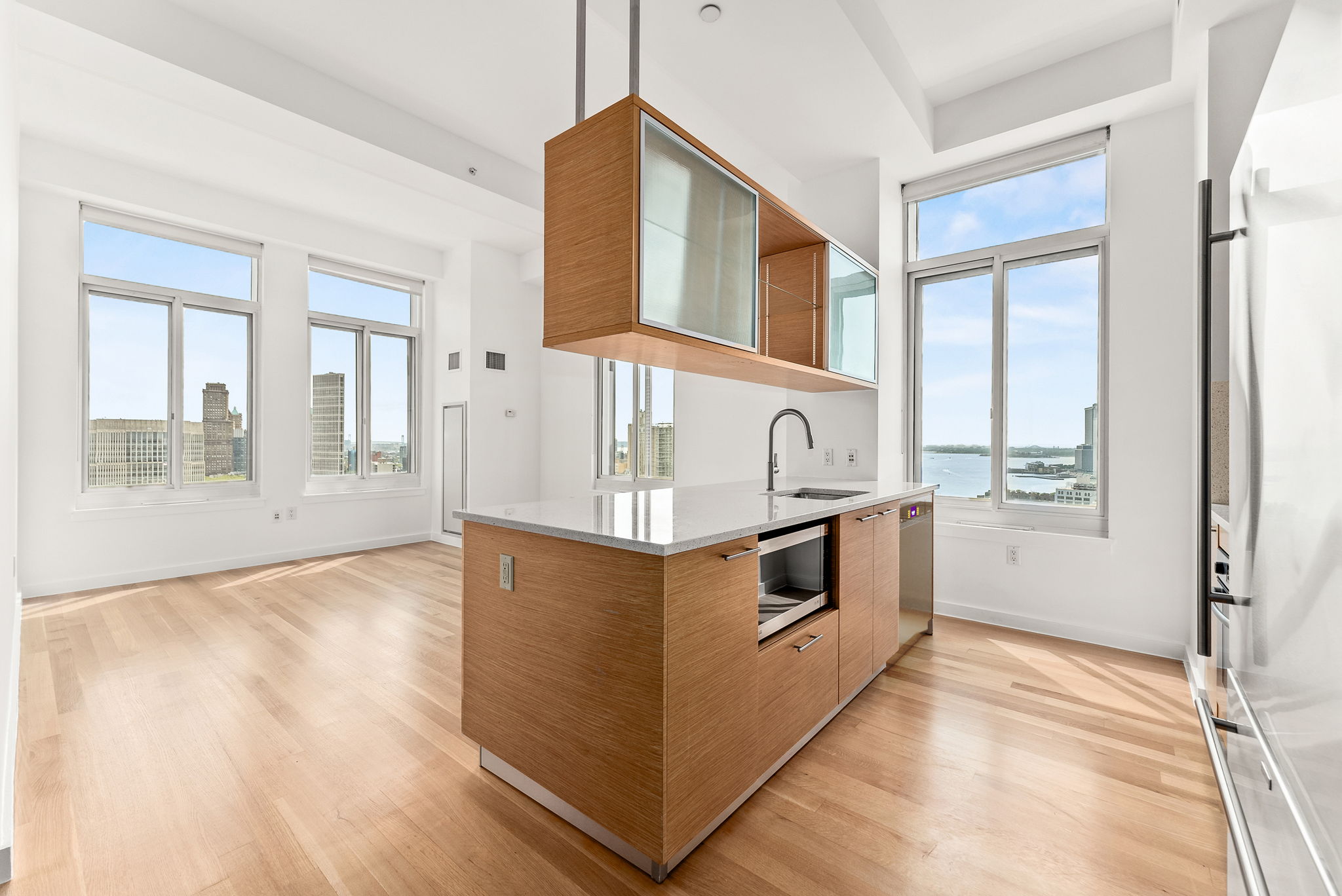 85 Adams Street, Unit 21A Brooklyn, NY 11201 - Photo 1 of 18 a kitchen with stainless steel appliances granite countertop a stove and a wooden floors