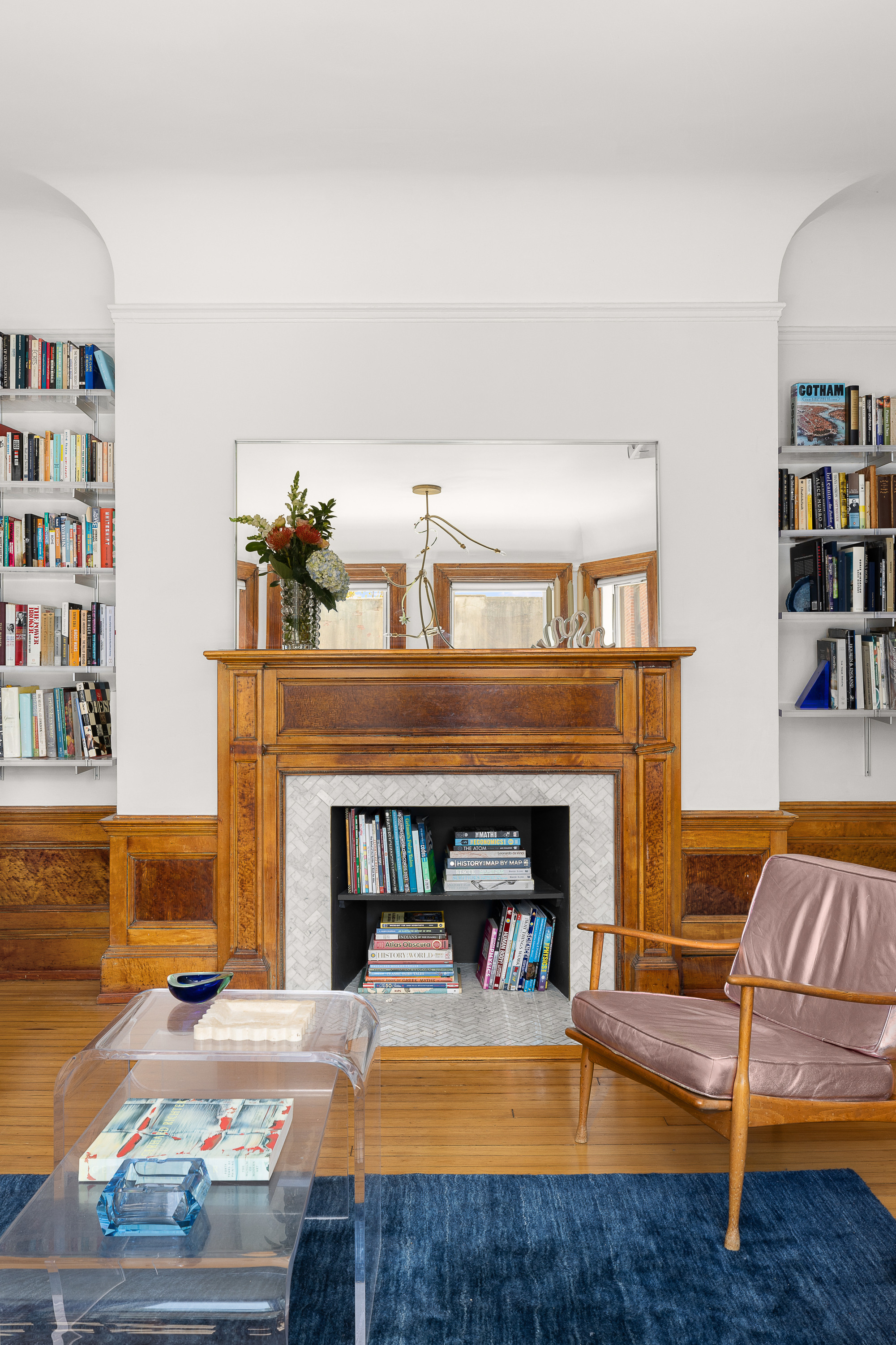 214 Carlton Avenue, Unit 2 Brooklyn, NY 11205 - Photo 2 of 16 a living room with furniture and a fireplace