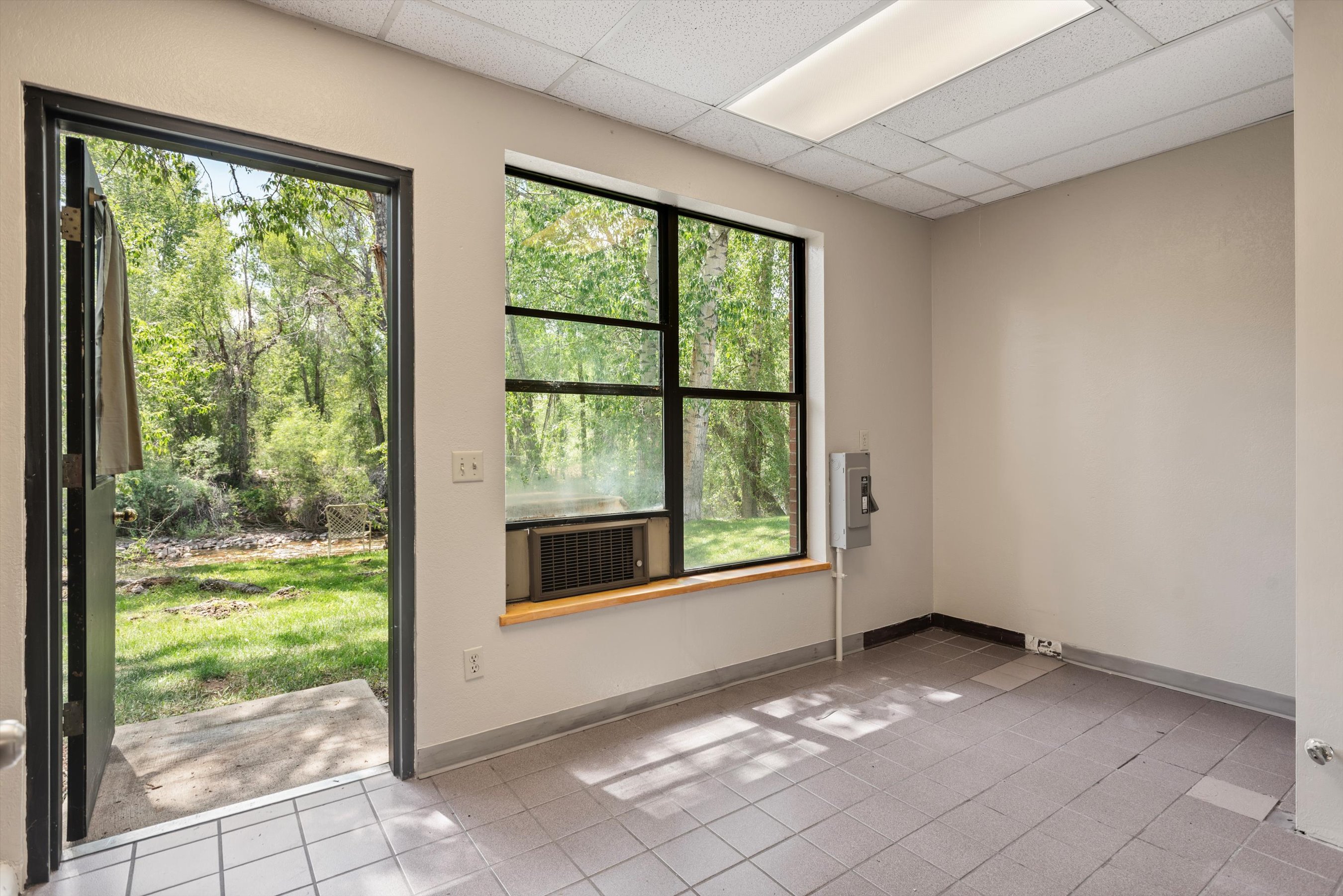 23286 Two Rivers Road, Unit 23 Basalt, CO 81621 - Photo 13 of 14 a view of an empty room with windows