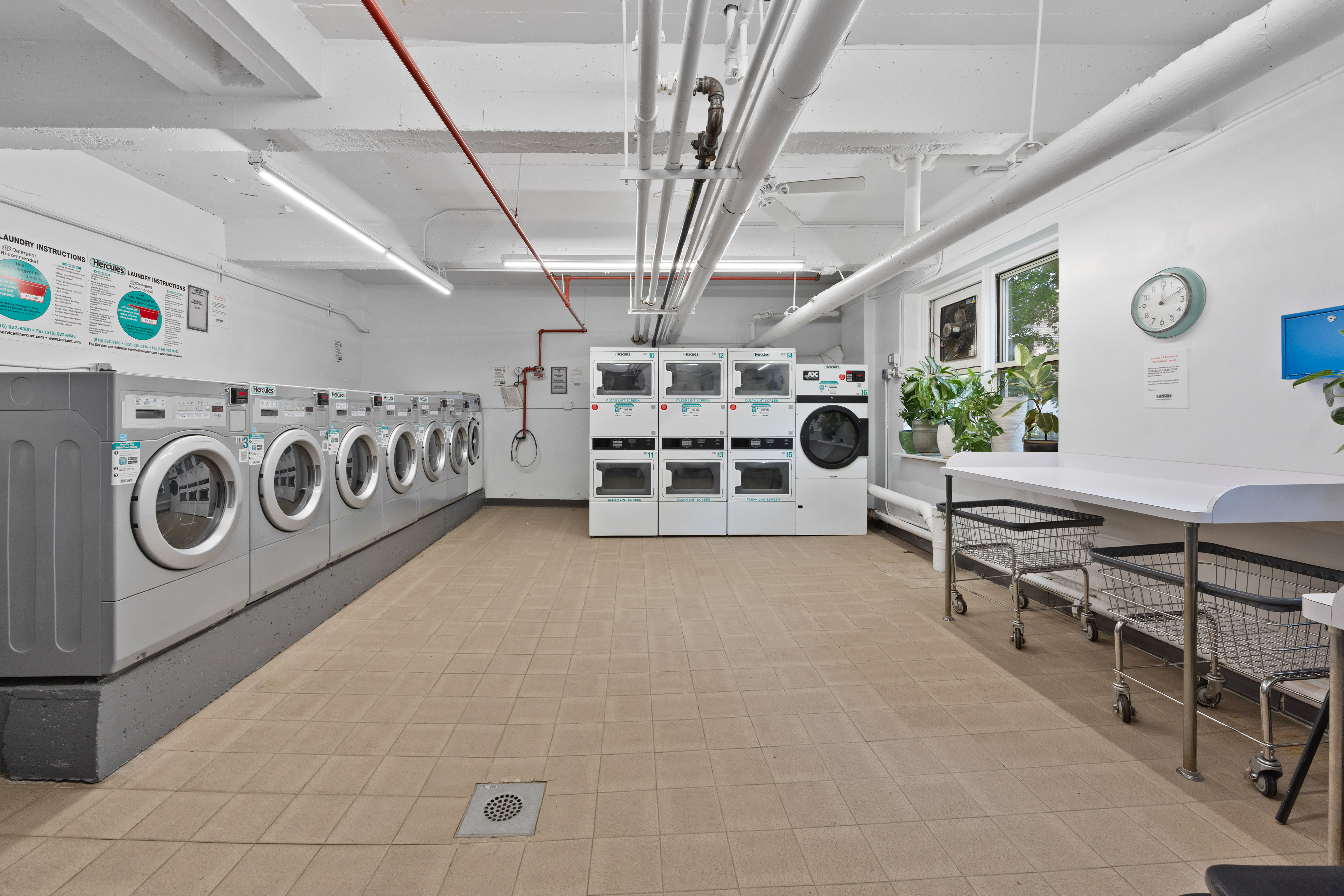 255 Fieldston Terrace, Unit 2L Bronx, NY 10471 - Photo 27 of 32 a room with stainless steel appliances washer and dryer