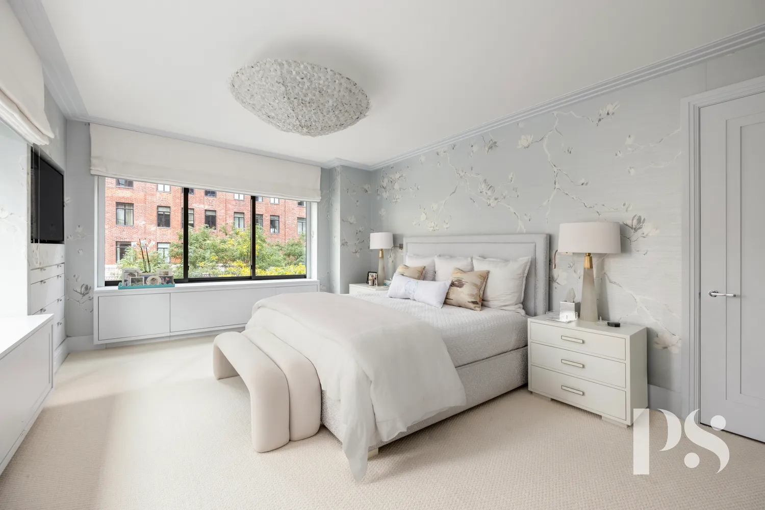 a bedroom with a large bed and a large window