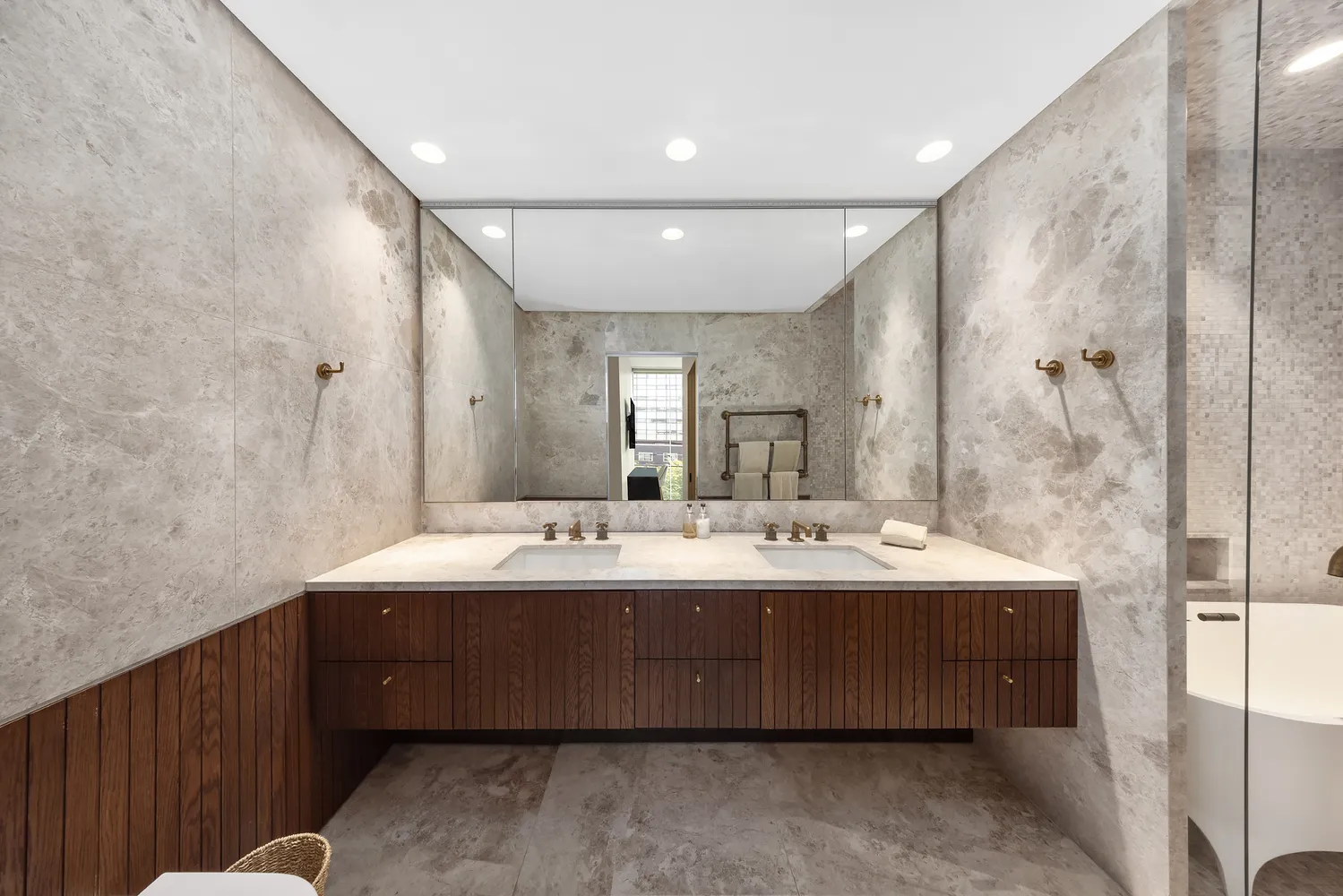 a bathroom with a double vanity sink mirror and double