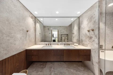 a bathroom with a double vanity sink mirror and double