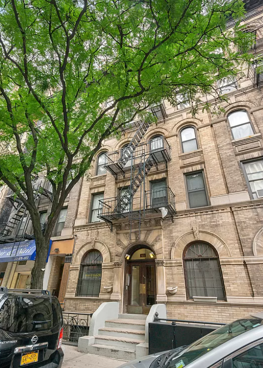 305 East 91st Street, Unit 2C Manhattan, NY 10128 - Photo 5 of 6 a view of a large building with large windows