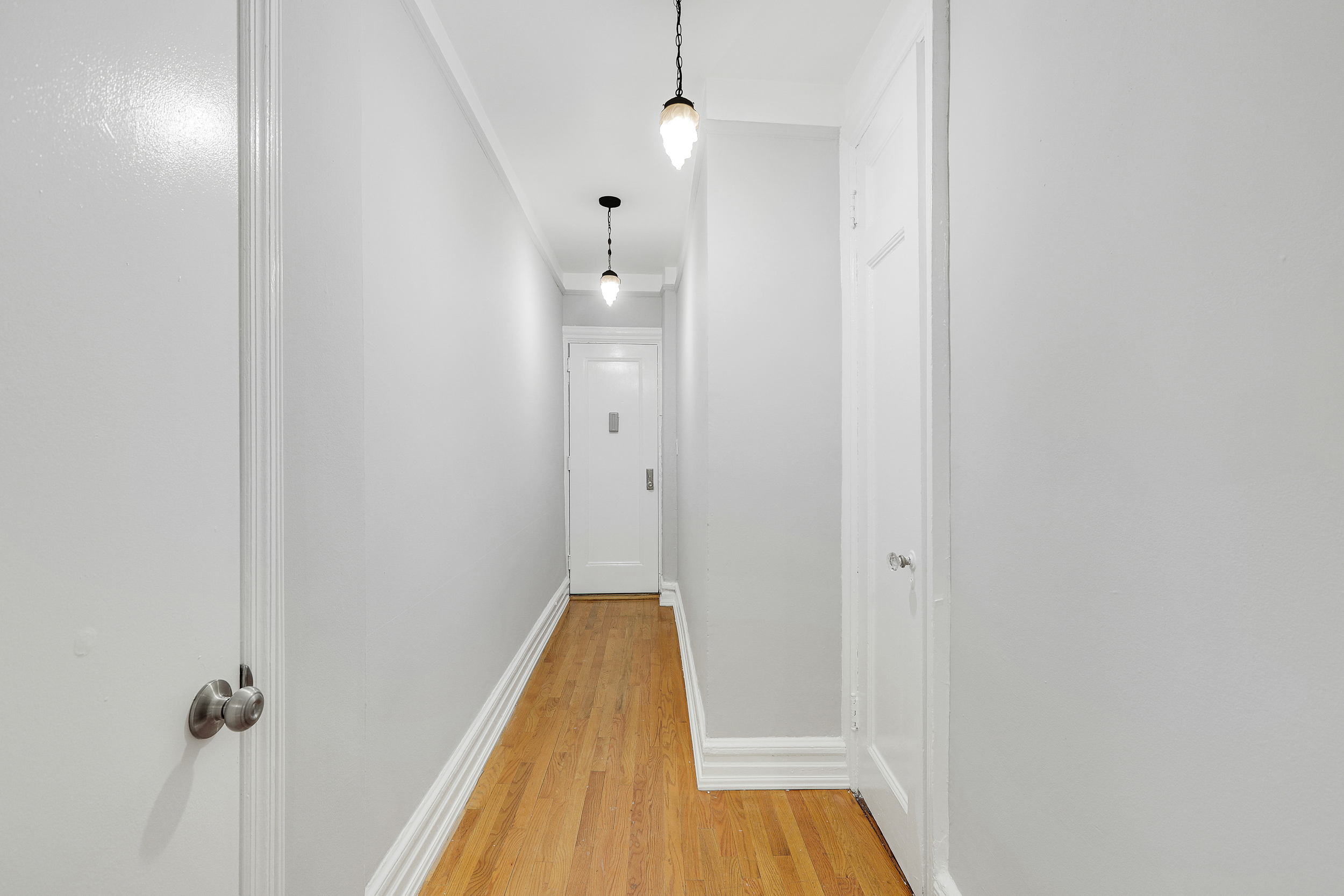 175 Prospect Park Southwest, Unit 1C Brooklyn, NY 11218 - Photo 10 of 12 a view of a room with wooden floor and shower