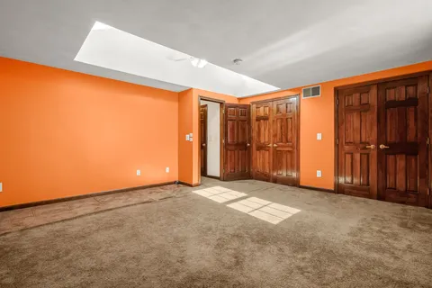 an empty room with closet area