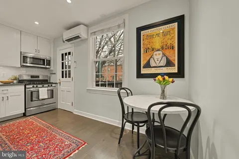a view of a dining room with furniture and window
