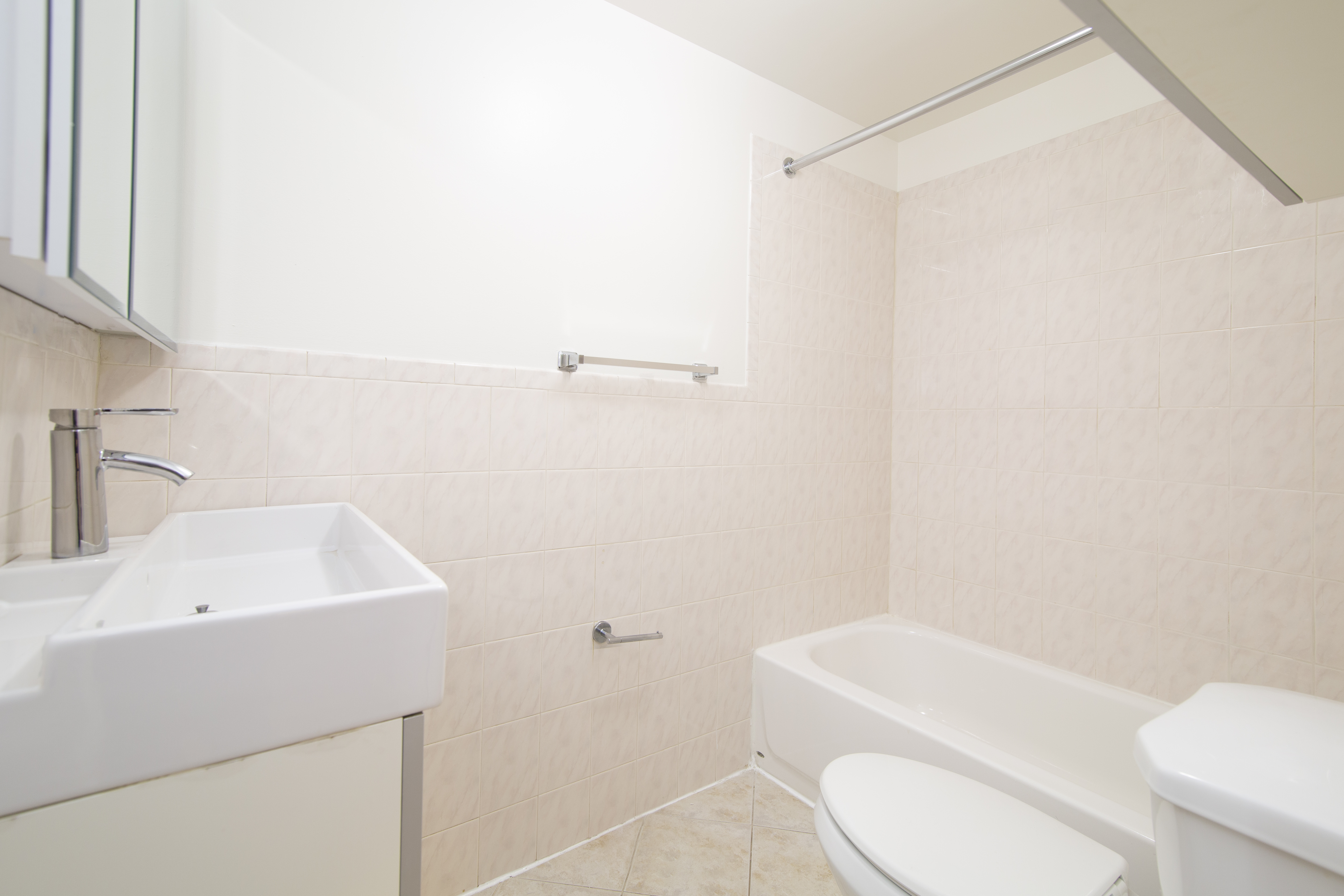 304 Bleecker Street, Unit 3F Manhattan, NY 10014 - Photo 5 of 6 a bathroom with a sink a toilet and shower