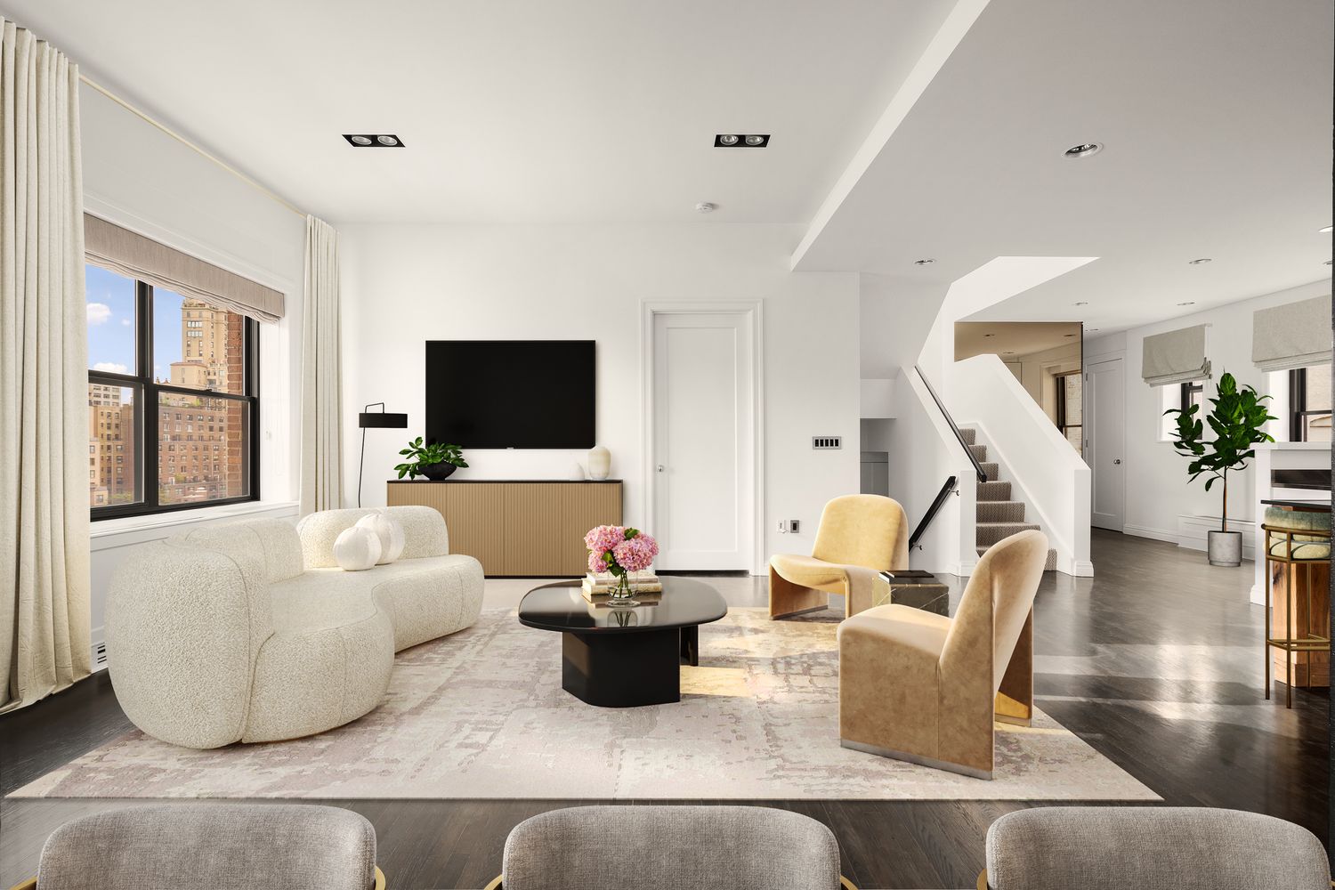 a living room with furniture and a flat screen tv