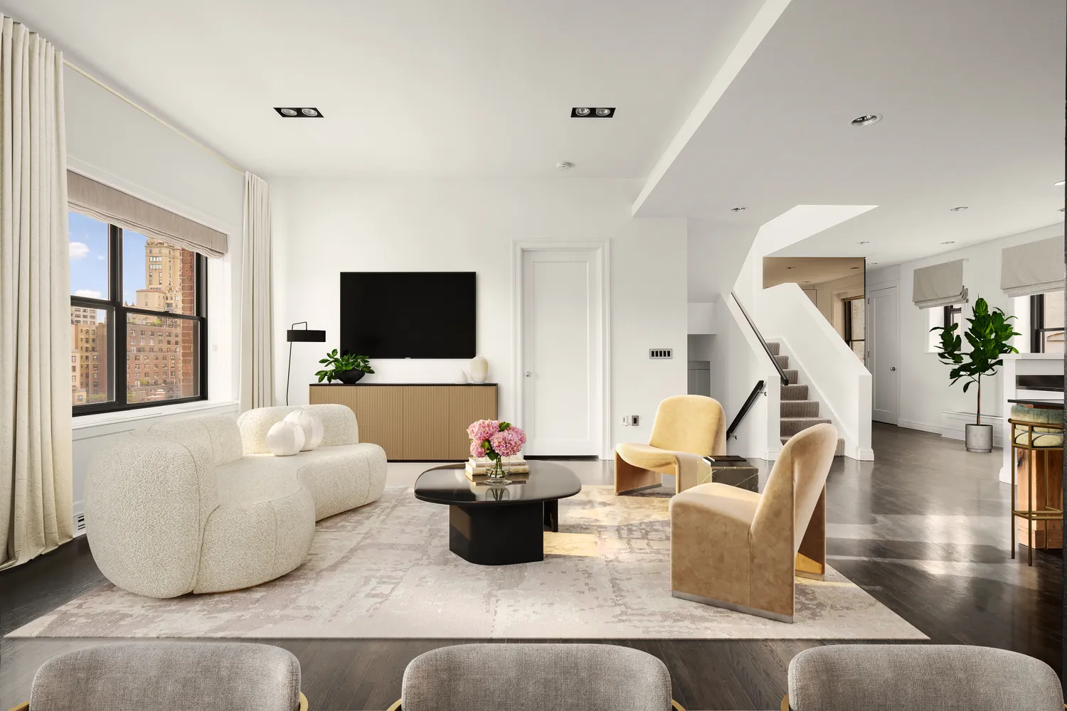 a living room with furniture and a flat screen tv