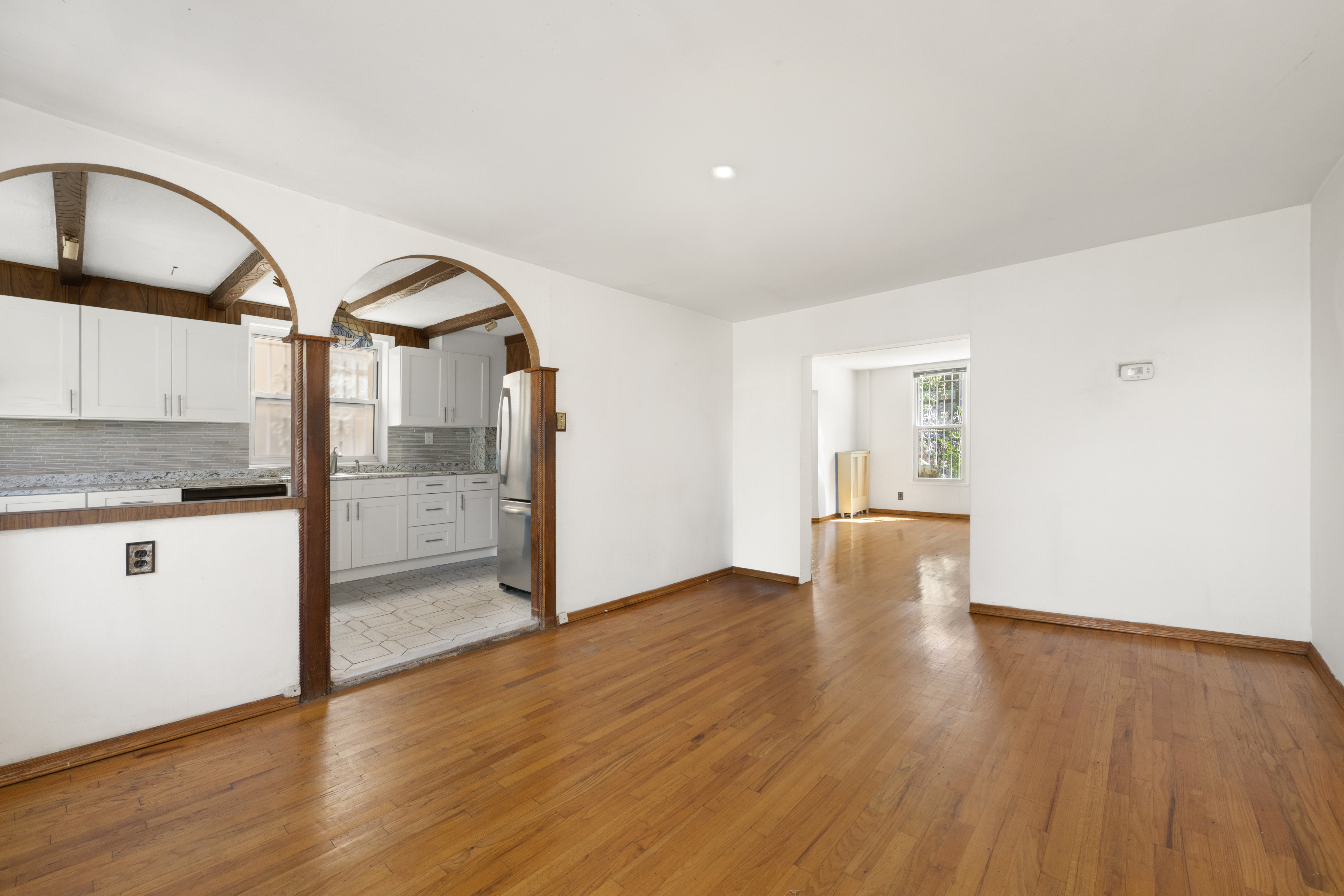 37-34 28th Street Queens, NY 11101 - Photo 6 of 17 a view of a kitchen with wooden floor and a sink