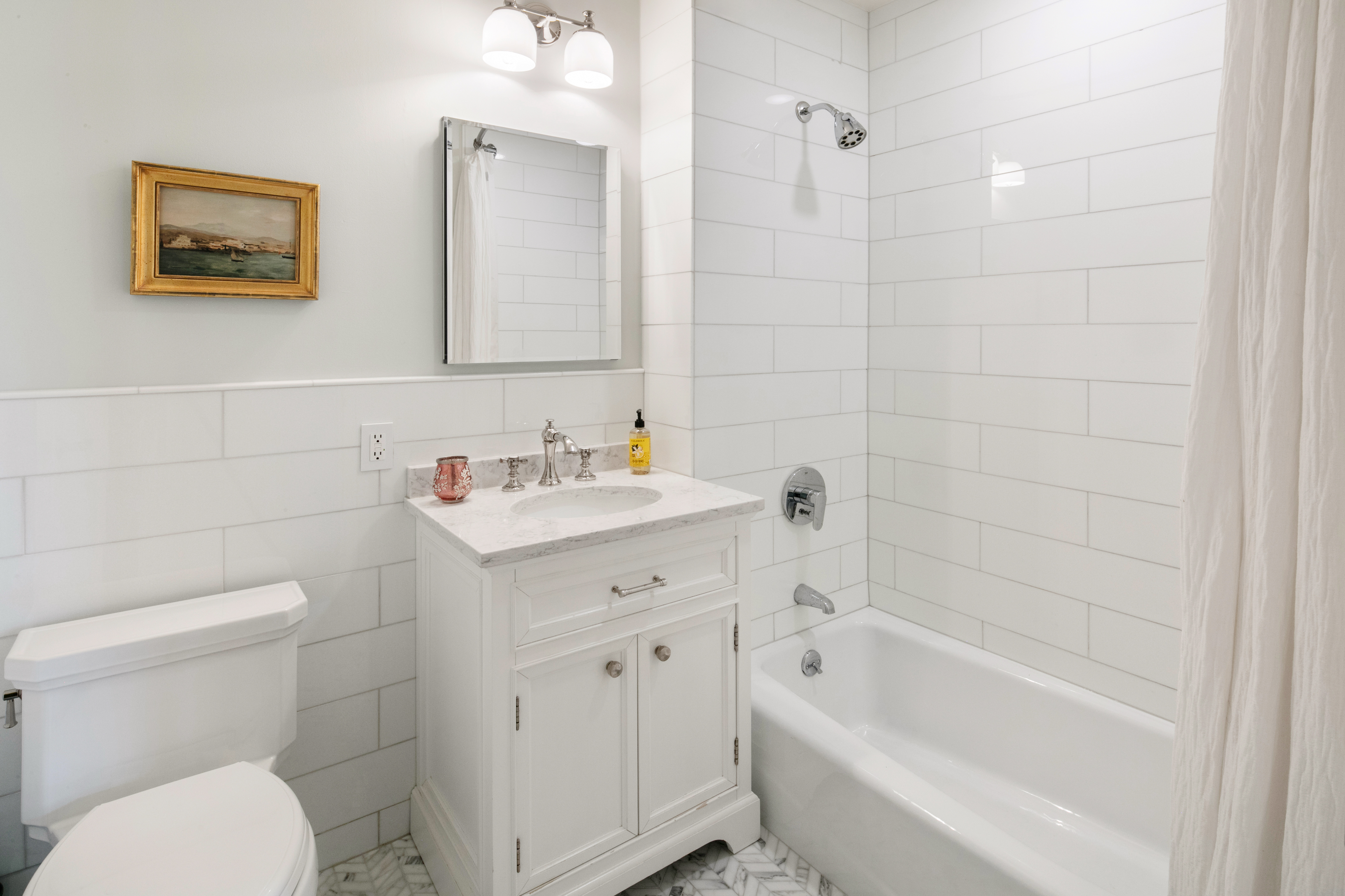 5 West 127th Street, Unit 3B Manhattan, NY 10027 - Photo 8 of 9 a bathroom with a toilet sink and bathtub