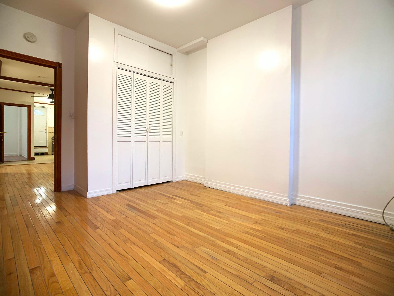 630 President Street, Unit 1 Brooklyn, NY 11215 - Photo 7 of 11 a view of an empty room with wooden floor