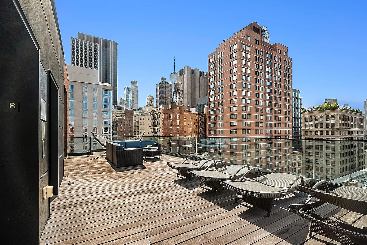 84 White Street, Unit 5B Manhattan, NY 10013 - Photo 5 of 7 a view of roof deck with wooden floor and city view