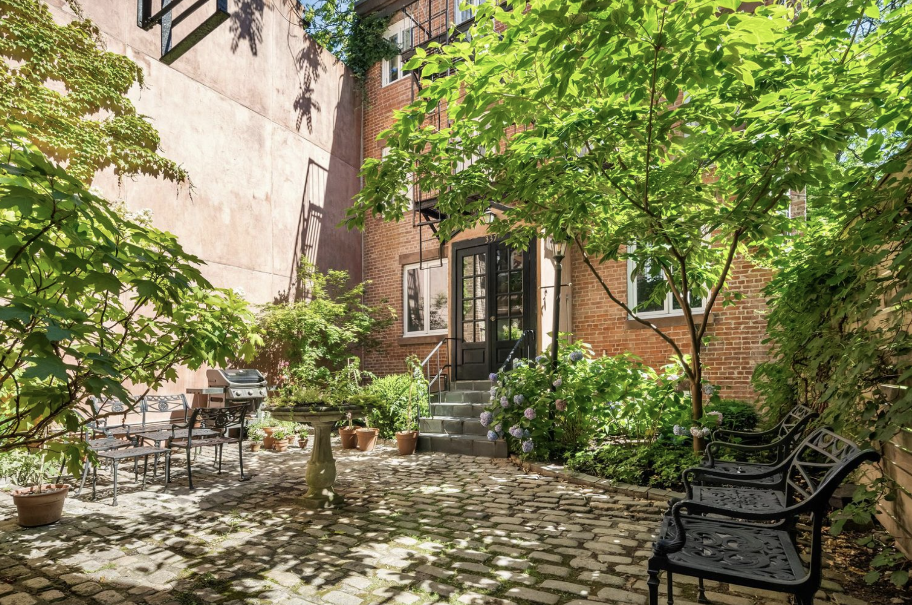 337 West 20th Street, Unit 1B Manhattan, NY 10011 - Photo 2 of 11 a house with lots of trees