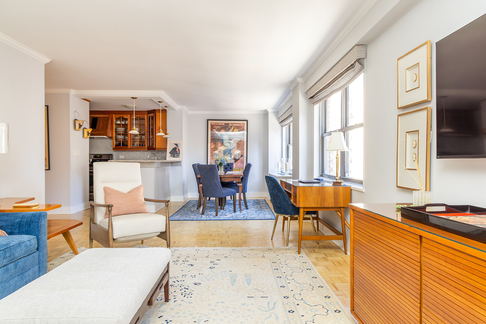 132 East 35th Street, Unit 7H Manhattan, NY 10016 - Photo 3 of 25 a living room with furniture a rug and a large window