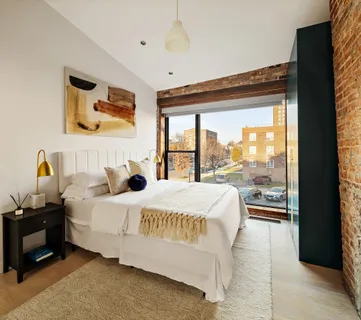 a view of a chairs and table in a backyard