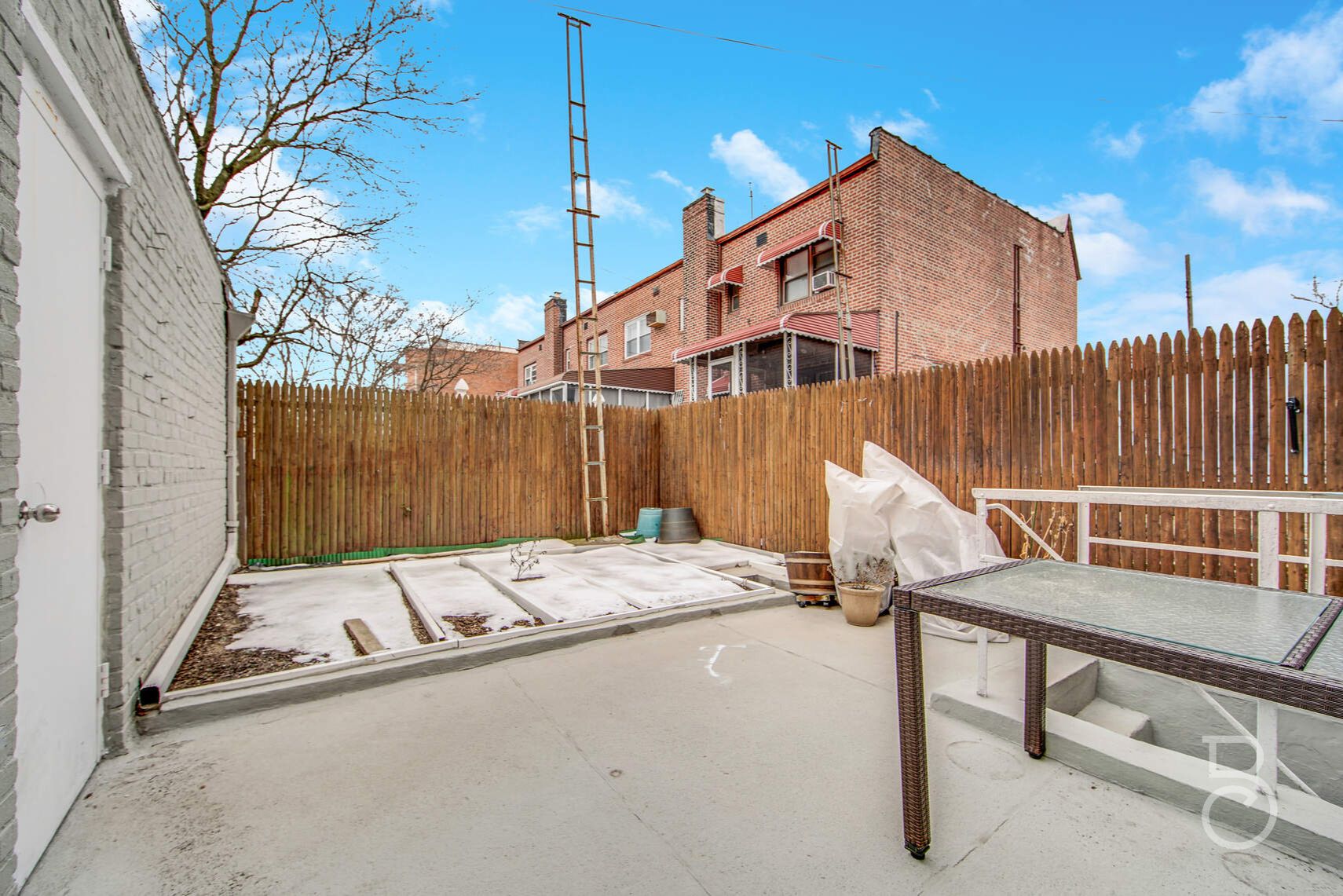 46-10 28th Avenue Queens, NY 11103 - Photo 13 of 16 a wooden bench sitting in front of a building
