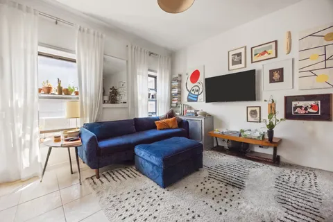 a view of workspace with wooden floor windows