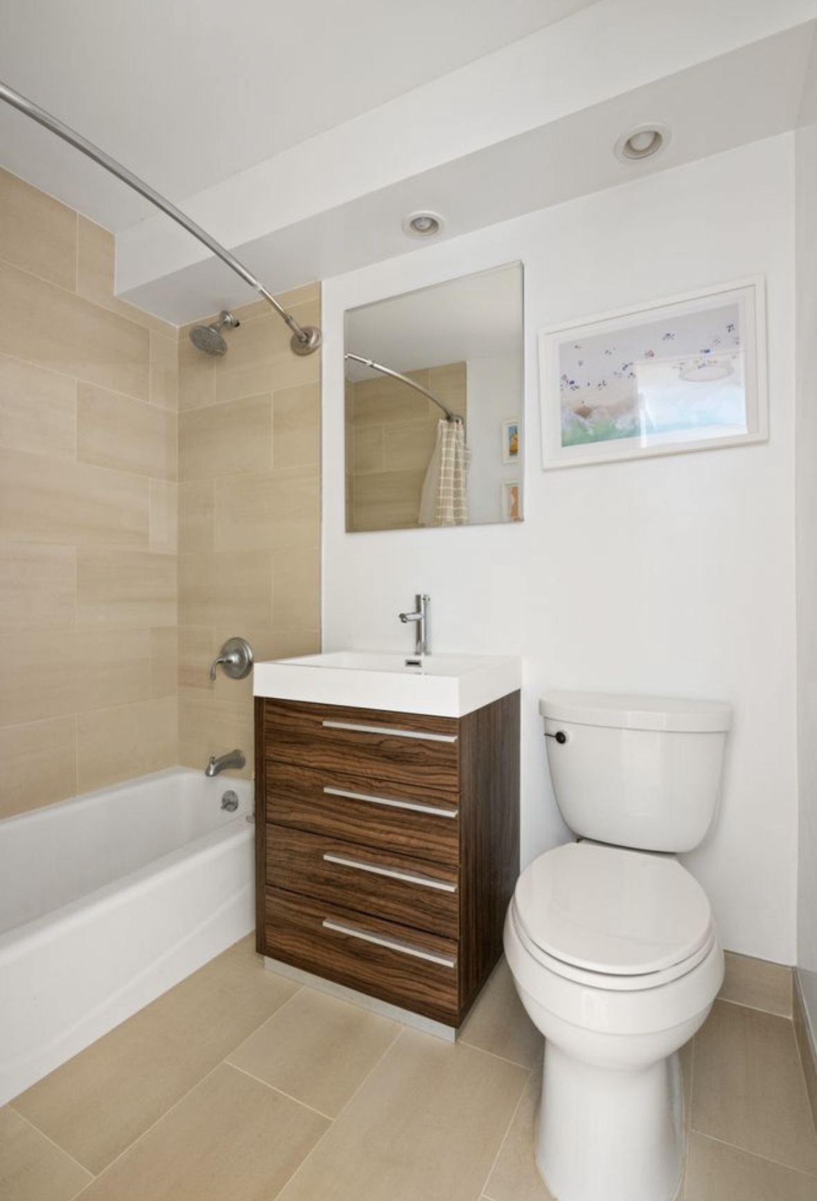 201 East 25th Street, Unit 4C Manhattan, NY 10010 - Photo 4 of 6 a bathroom with a toilet a sink and bathtub