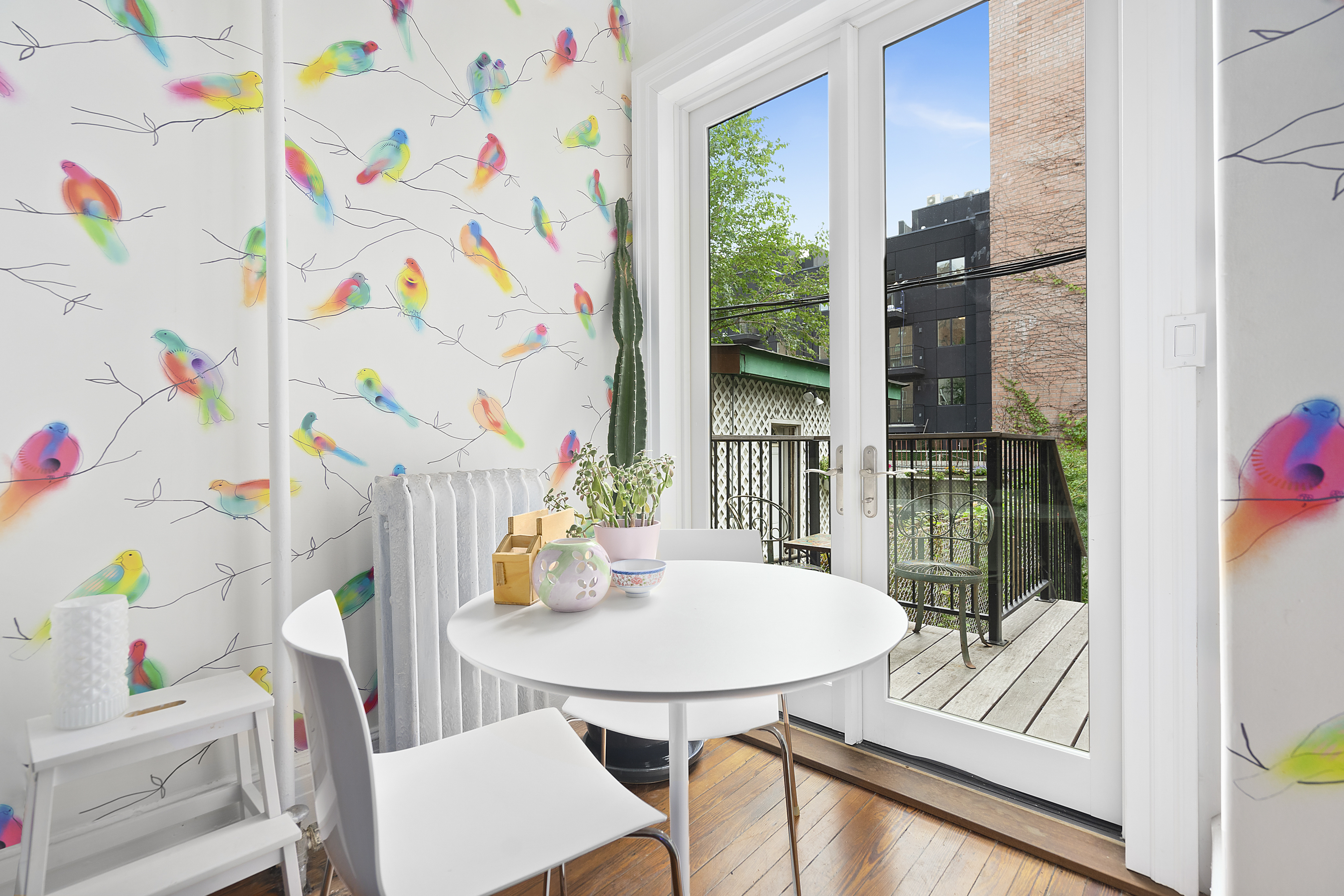 394 Lafayette Avenue, Unit 2 Brooklyn, NY 11238 - Photo 3 of 13 a view of a dining room with furniture and a potted plant