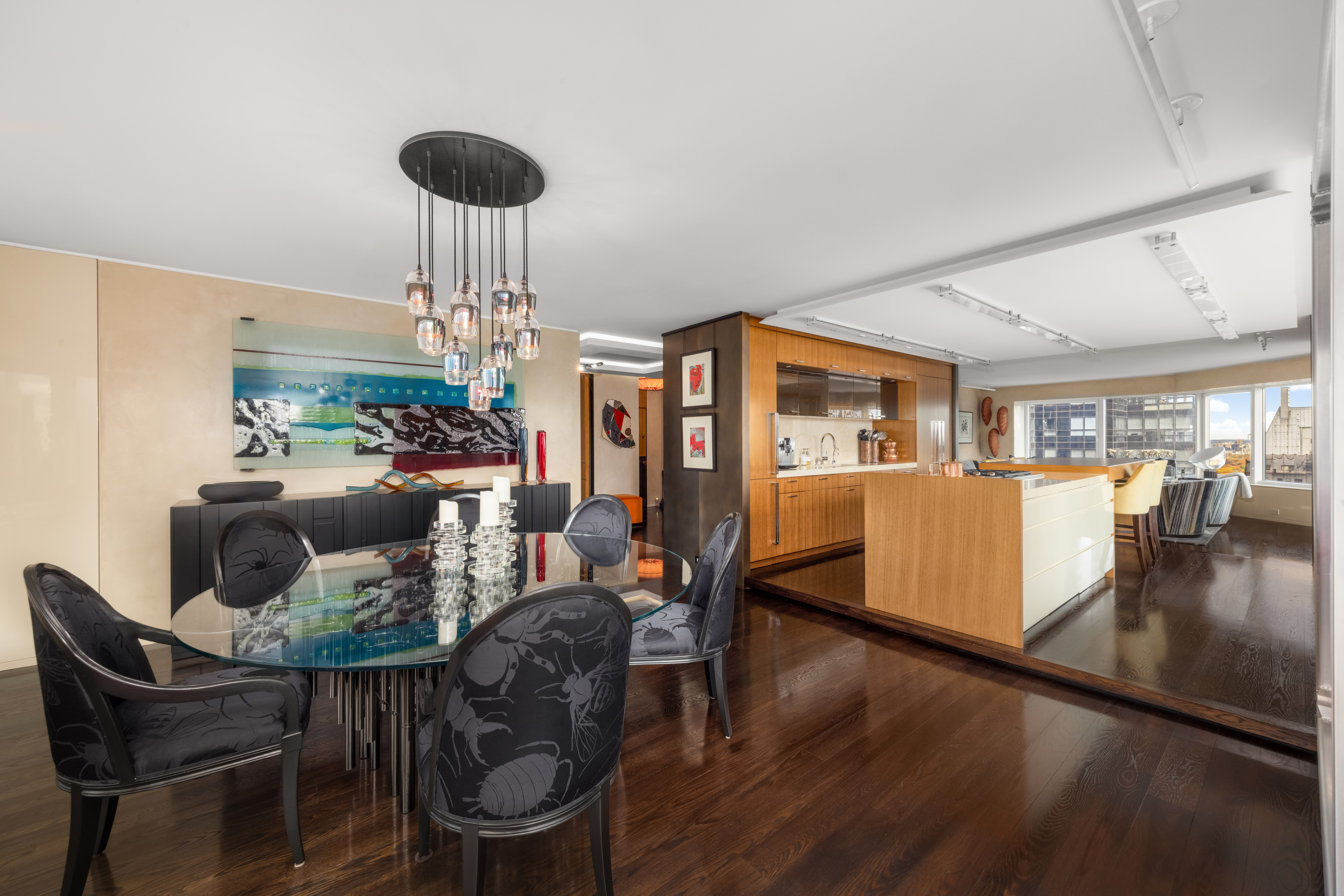 150 West 56th Street, Unit 3901 Manhattan, NY 10019 - Photo 5 of 25 a living room with furniture and a chandelier