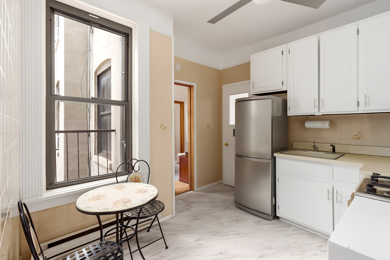 a kitchen with a refrigerator a sink and a stove