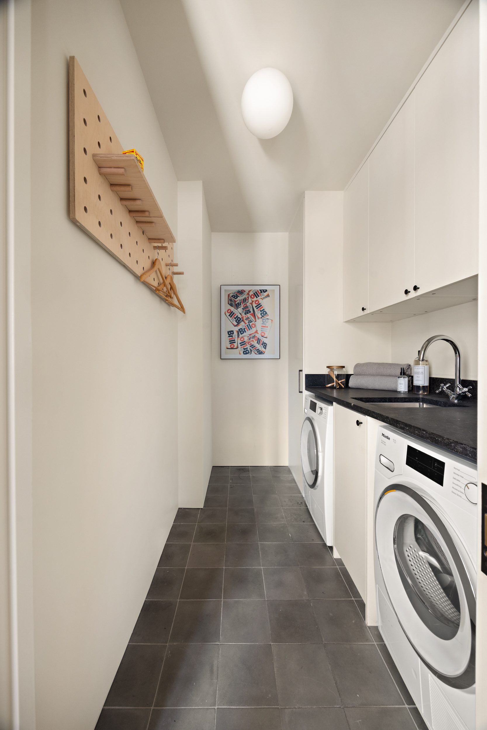 110 Duane Street, Unit PH3S Manhattan, NY 10007 - Photo 18 of 23 a view of a kitchen with a washer and dryer