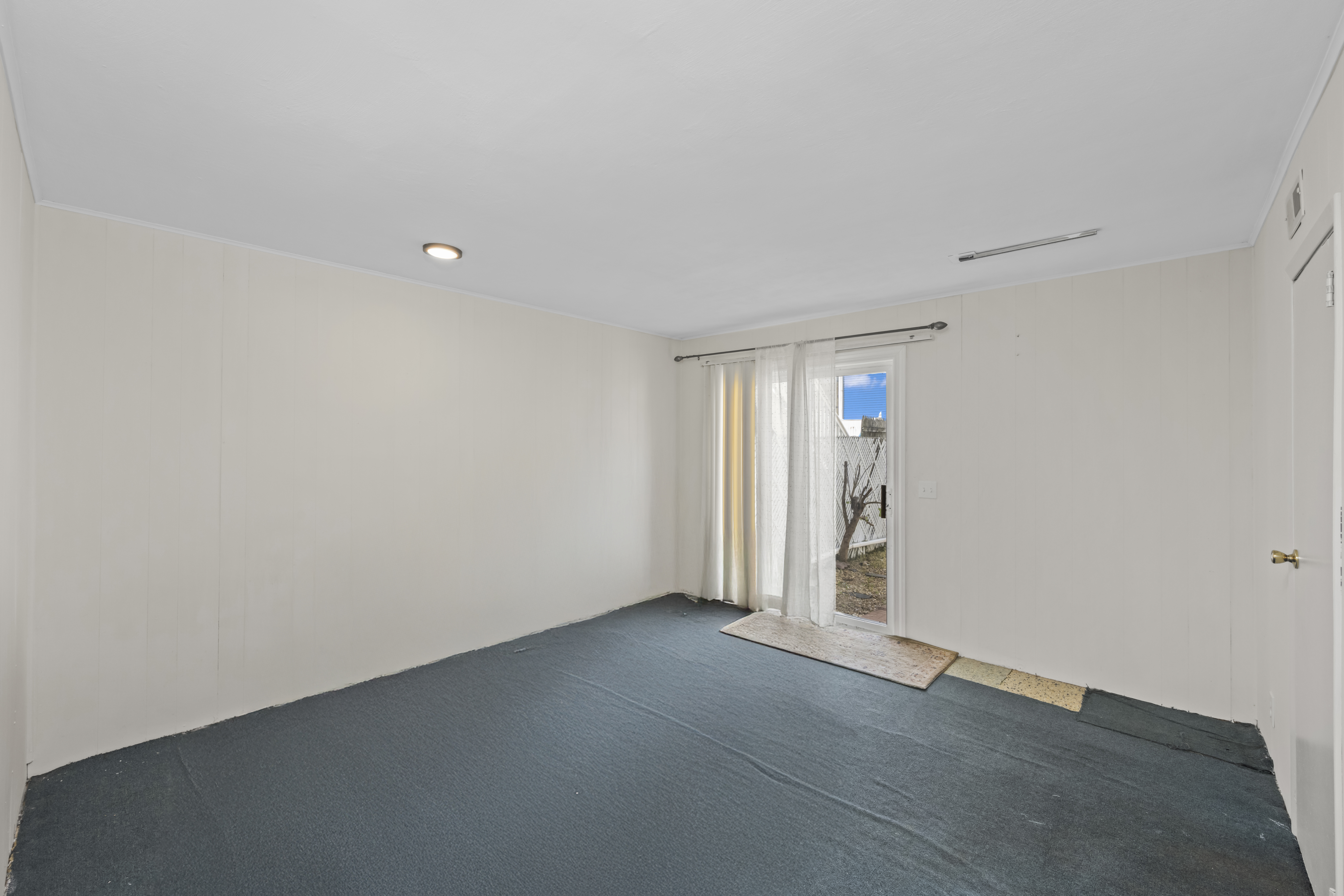 12 Yucca Drive Staten Island, NY 10312 - Photo 17 of 21 an empty room with an entryway