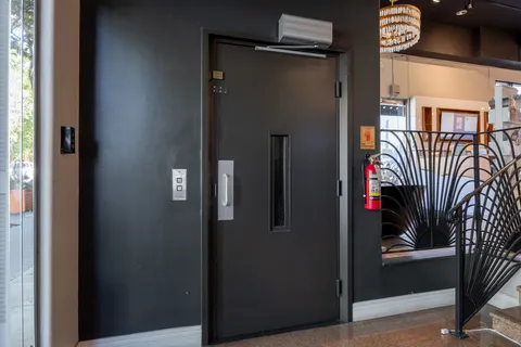a view of a hallway with entryway door