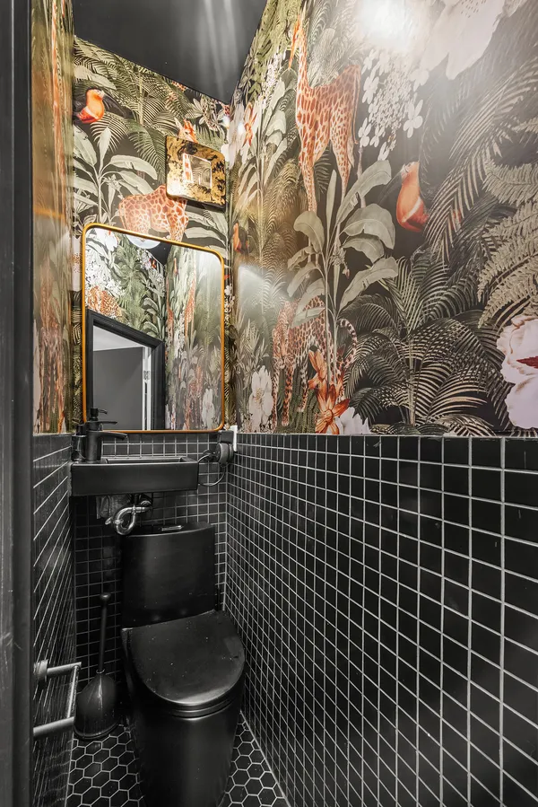 a bathroom with a toilet and a sink