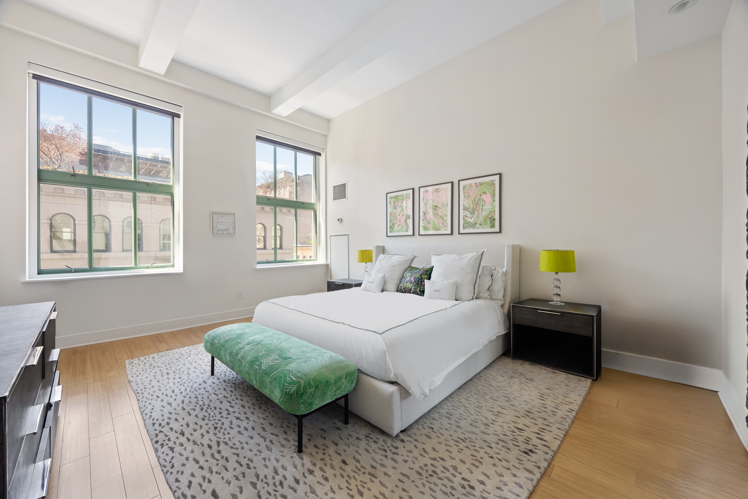 415 Greenwich Street, Unit 5D Manhattan, NY 10013 - Photo 6 of 16 a bedroom with a bed and wooden floor