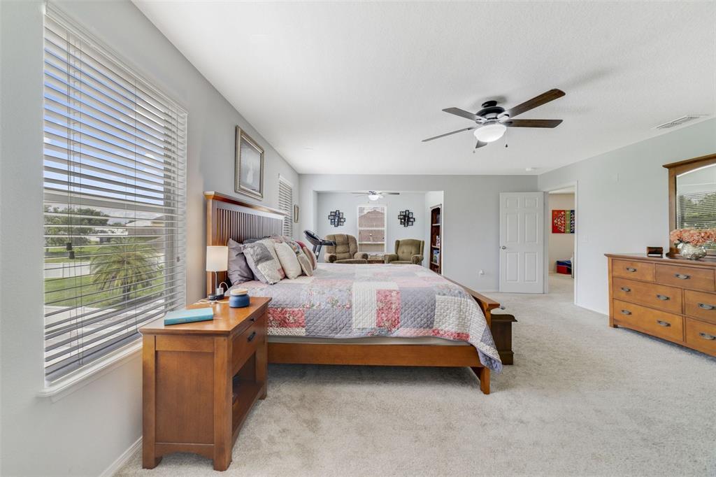 352 Giovani Boulevard Clermont, FL 34715 - Photo 23 of 46 a bed room with furniture and a large window