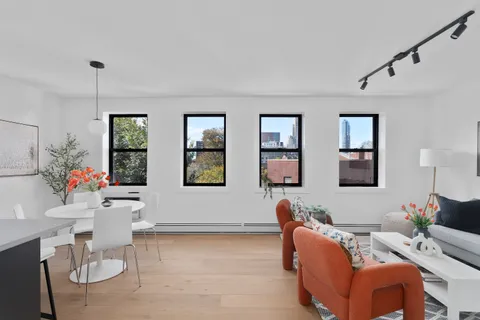 a living room with furniture and window