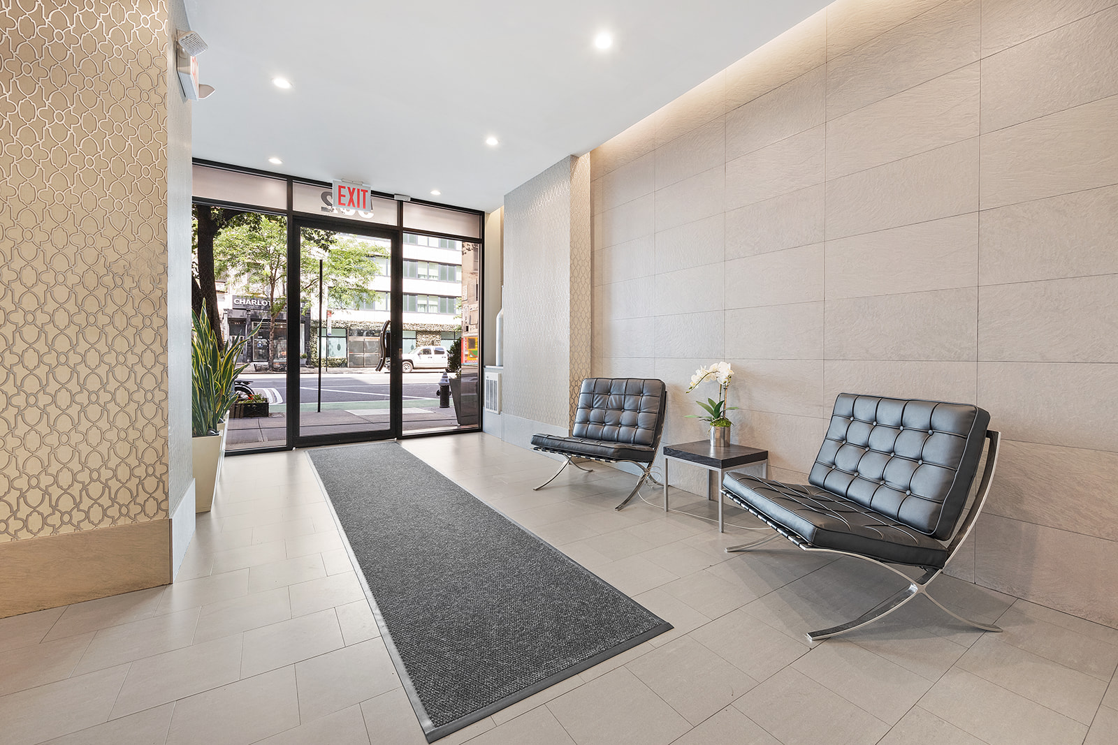 502 9th Avenue, Unit 4A Manhattan, NY 10018 - Photo 8 of 9 a living room with furniture and a floor to ceiling window