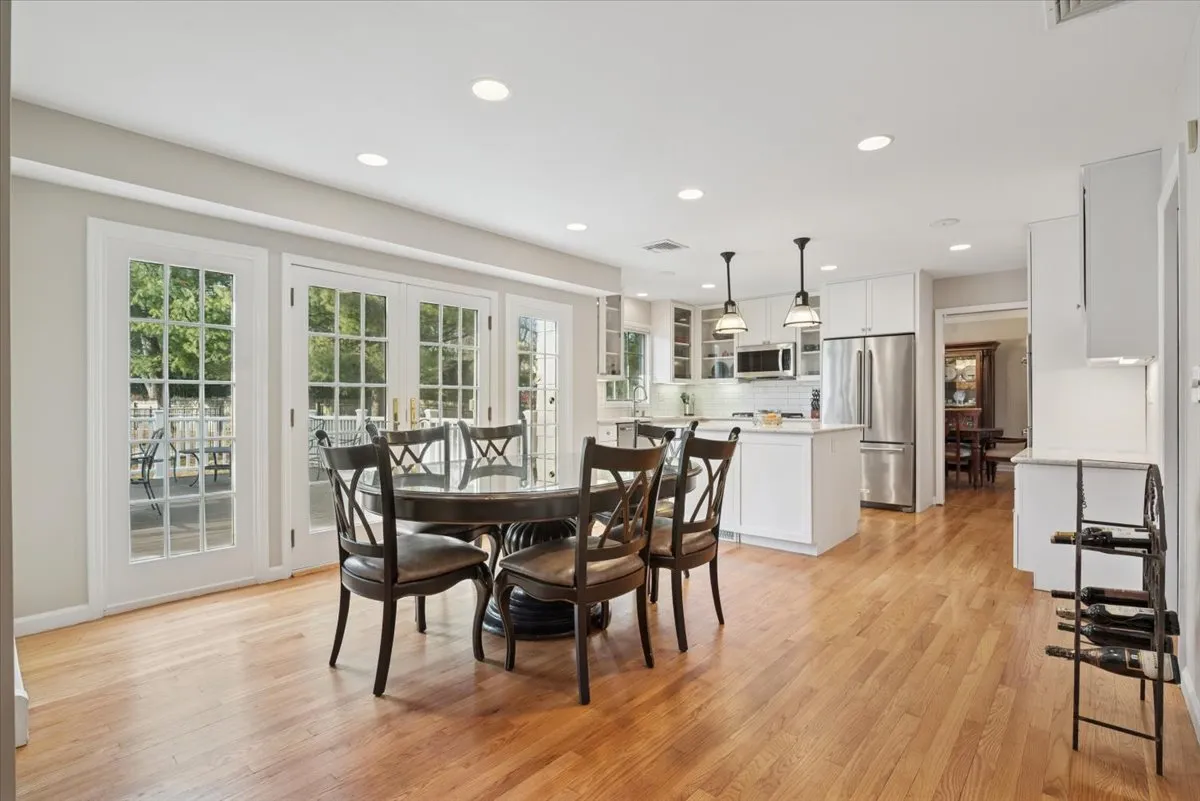 a view of a dining room with furniture and wooden floor