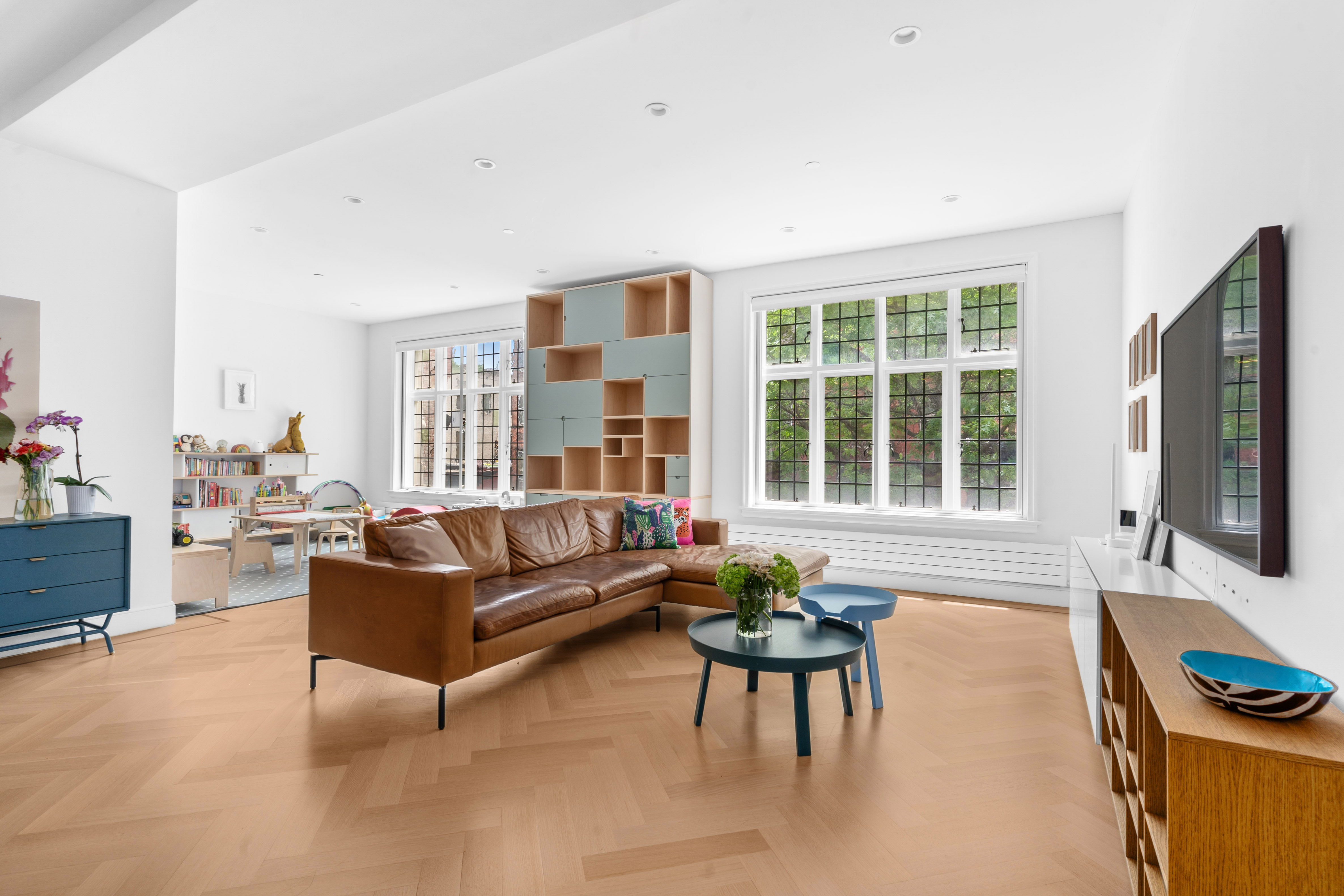 a living room with furniture and a flat screen tv