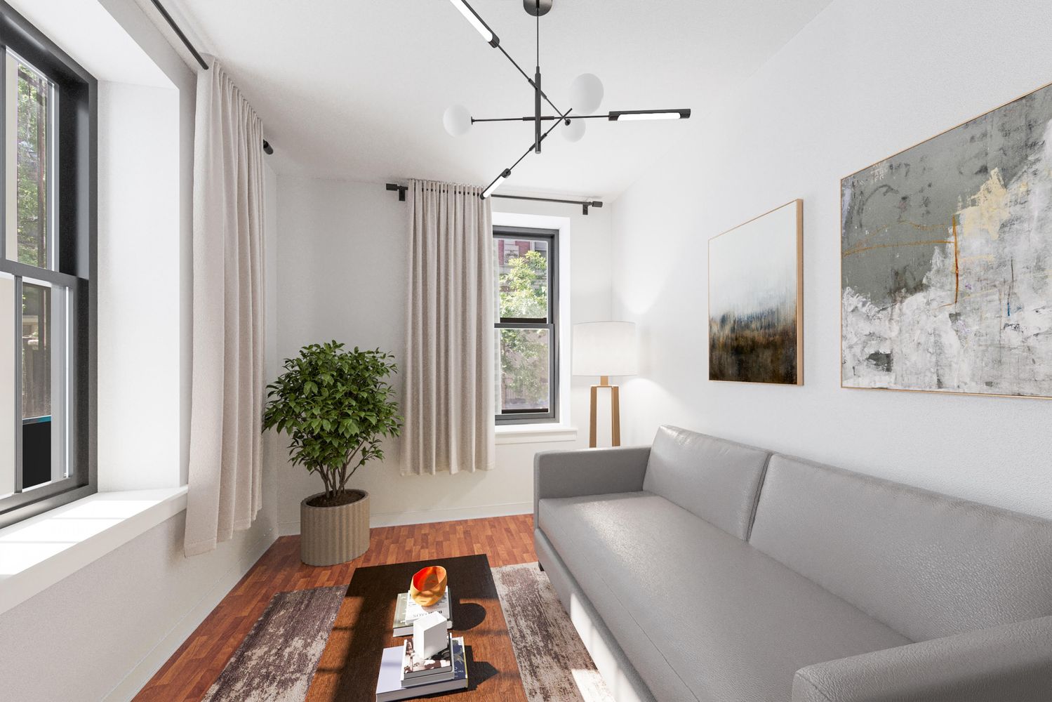 a living room with furniture and a potted plant